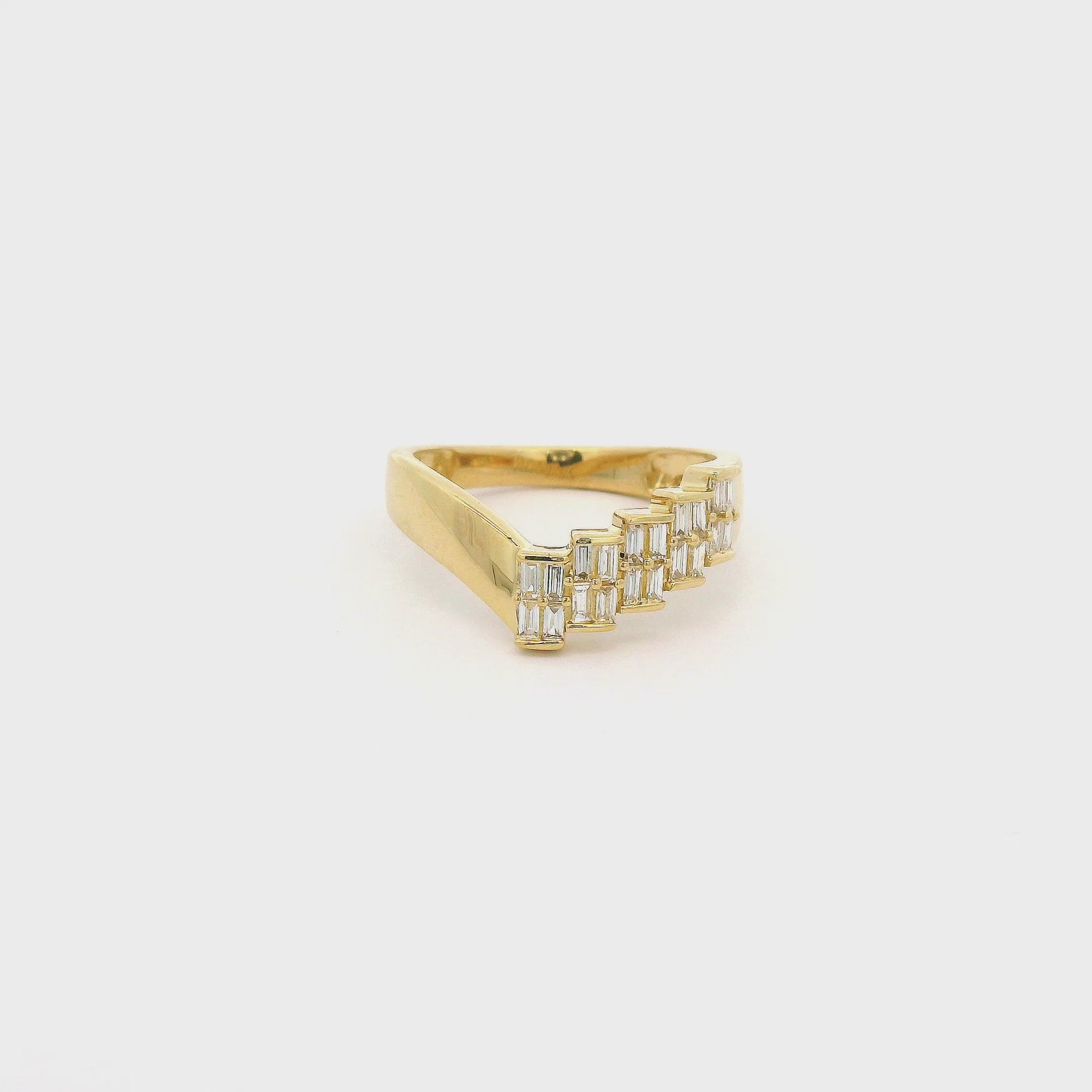 A Yellow Gold Ring withhalf of the ring set with bagguette cut diamonds in step form at Forever Rox Fine Jewelry, Lake Tahoes Best Jewelry Store
