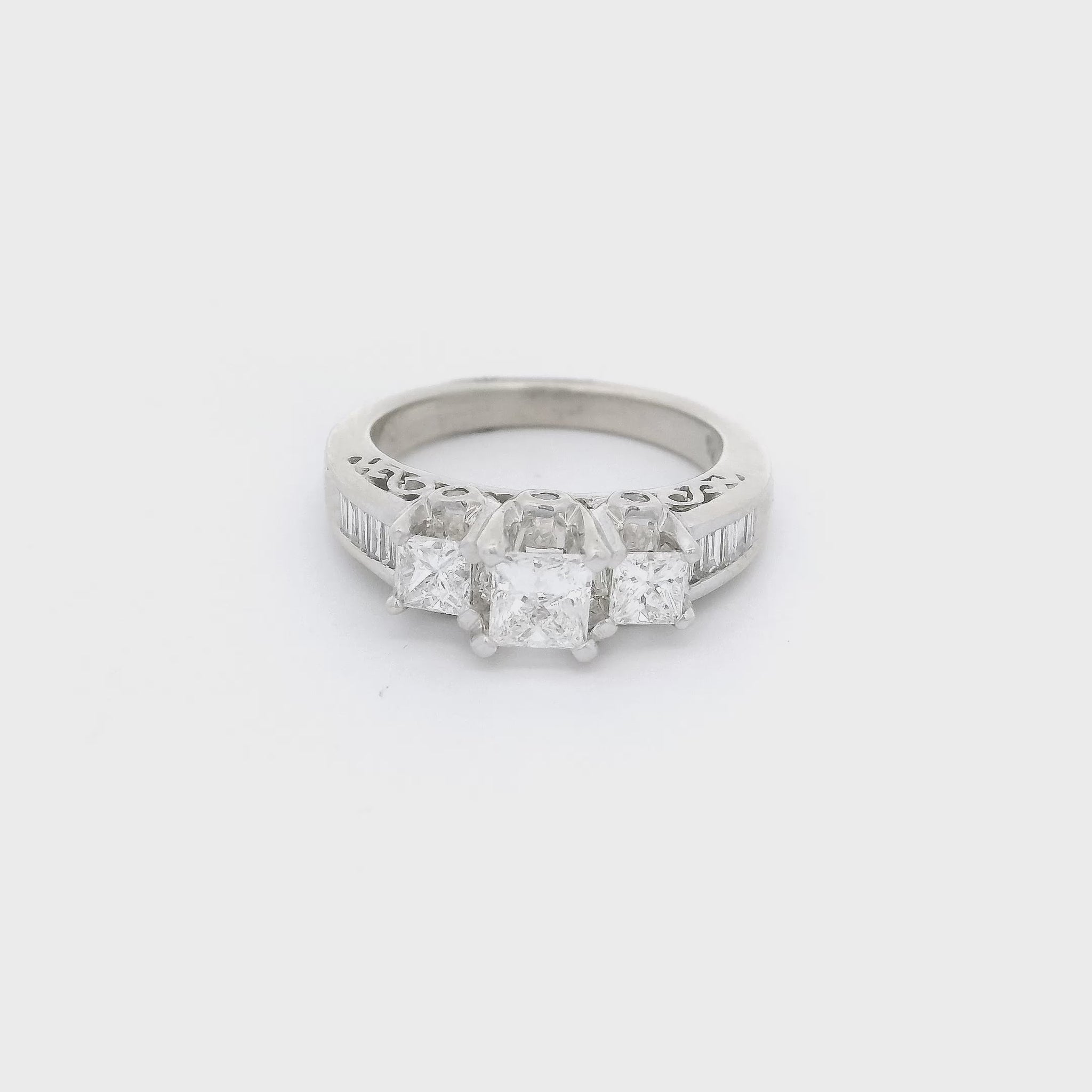 3 Princess cut diamonds and baguette diamonds set in a white gold ring at Forever Rox Fine Jewelry