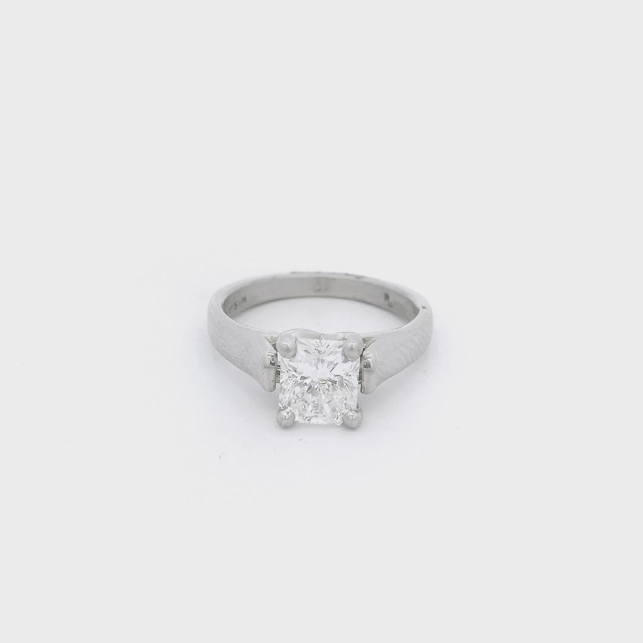 Platinum White ring with a cushion cut diamond set in a solitaire setting in the center at Forever Rox Fine Jewelry