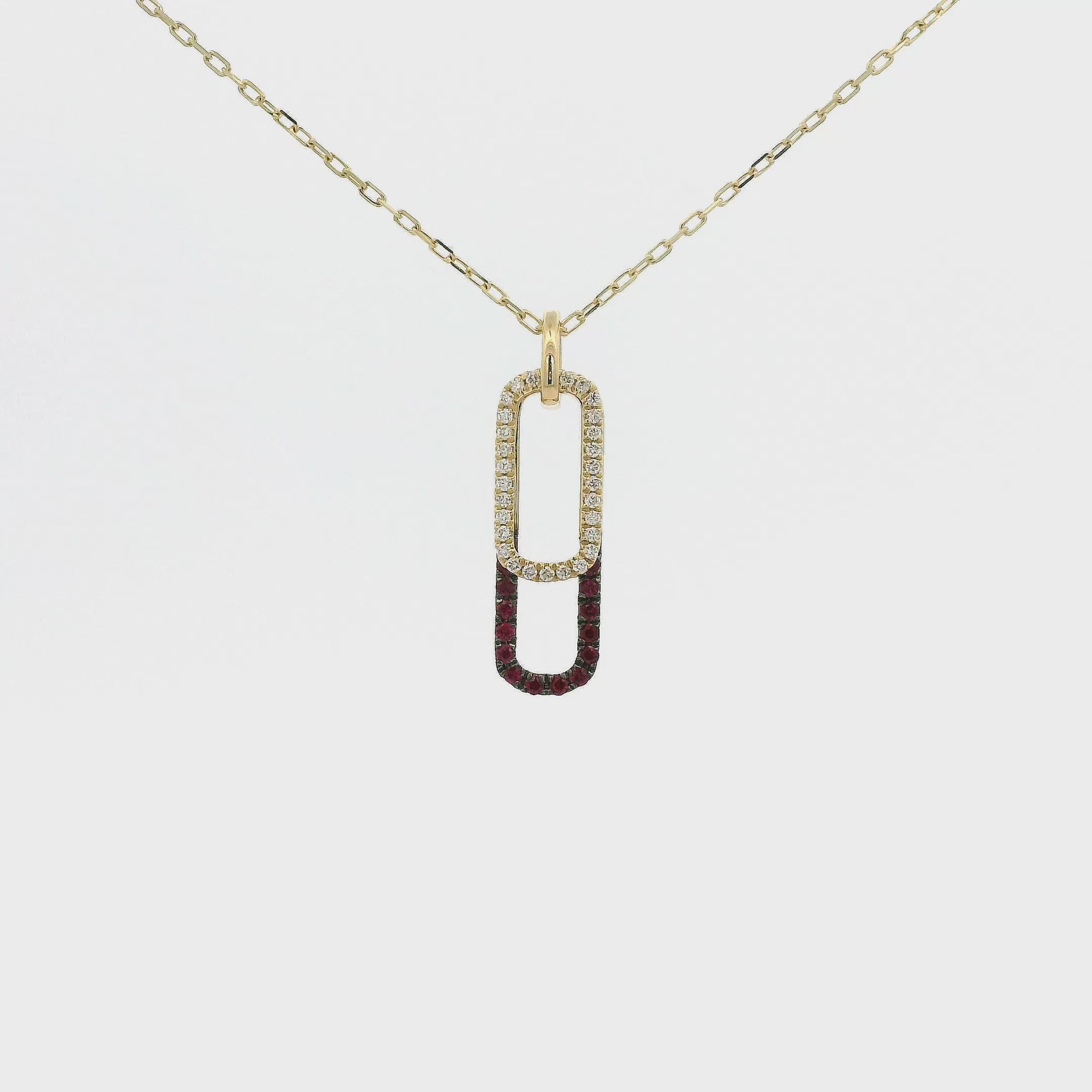 A Yellow Gold Pendant with two ovals, one with Natural Rubies and the other with Natural Diamonds at Forever Rox Fine Jewelry, Lake Tahoes Best Jewelry Store