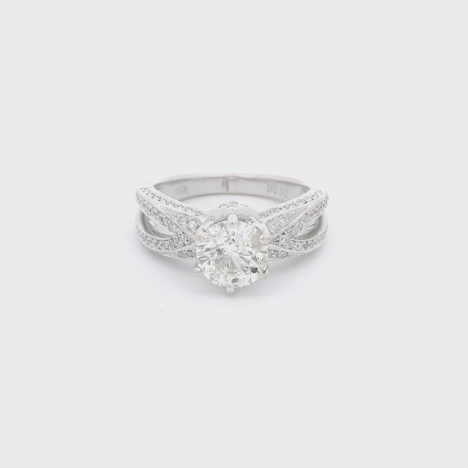 White Gold ring with one center set round cut diamond and diamond accents down the split shank at Forever Rox Fine Jewelry