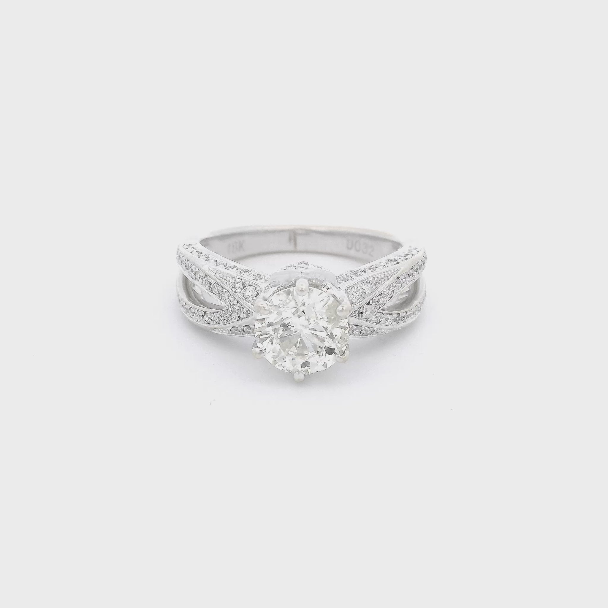 White Gold ring with one center set round cut diamond and diamond accents down the split shank at Forever Rox Fine Jewelry