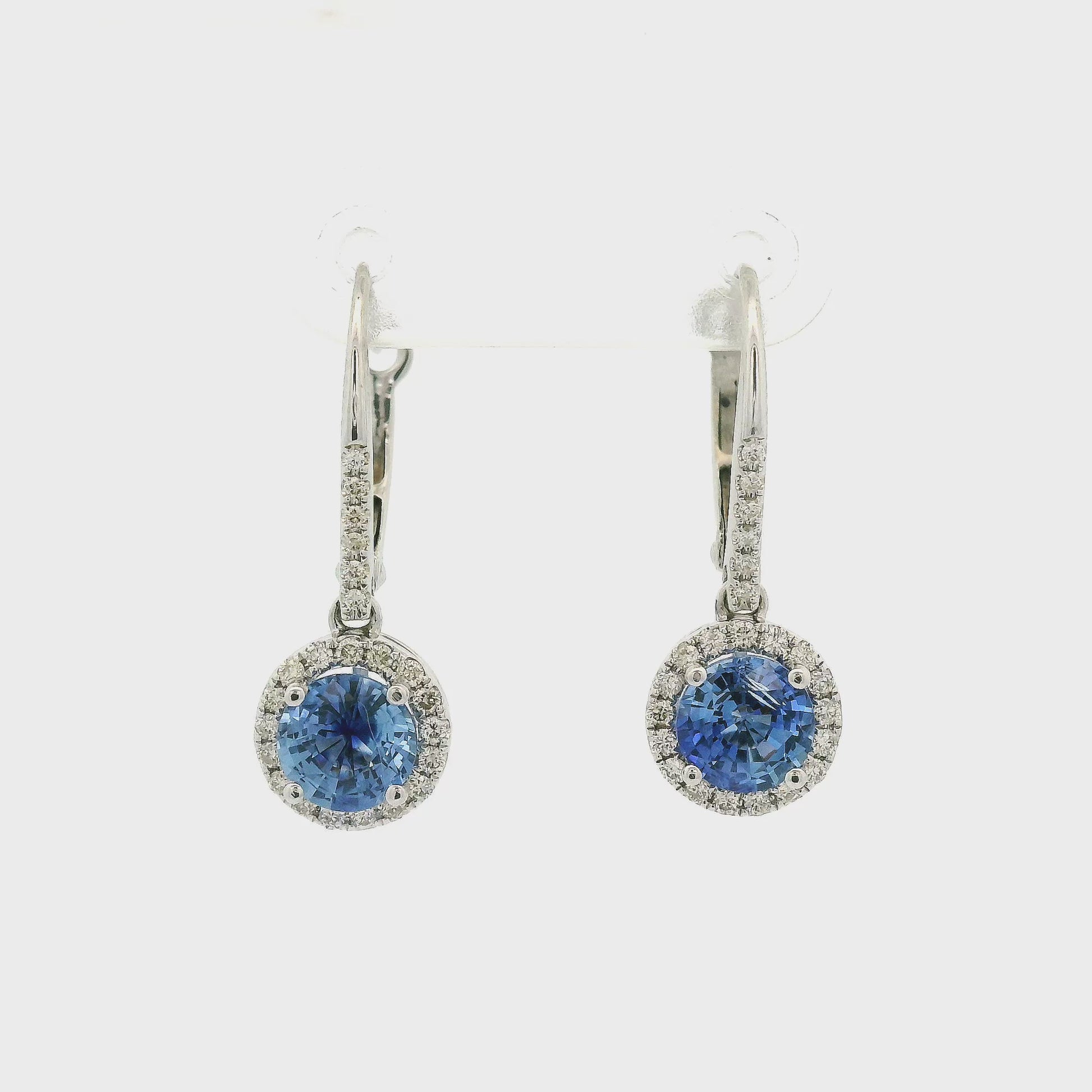 A Pair of Round Blue Ceylon Sapphires Set in White Gold Diamond Dangle Earrings at Forever Rox Fine Jewelry