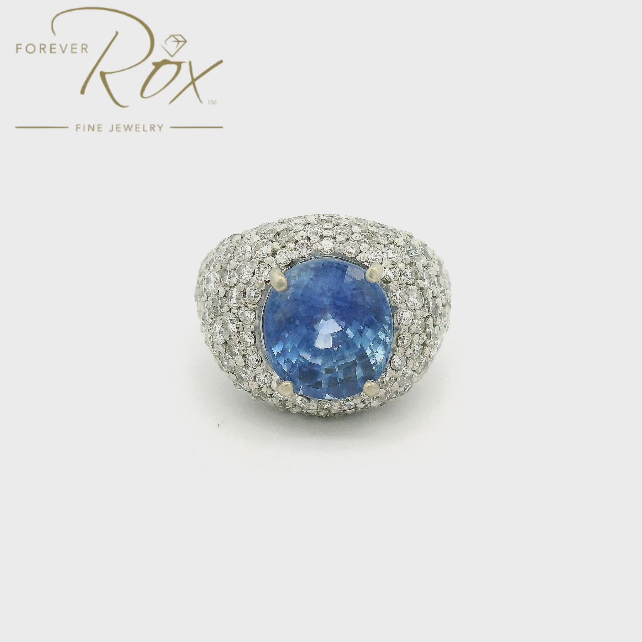 Oval Cut Light Blue Ceylonesse Sapphire set in white gold ring with pavé set diamonds at Forever Rox Fine Jewelry 