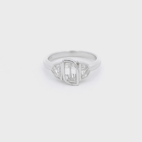One flame cut diamond and two Cadillac cut diamonds bezel in in a white gold ring Forever Rox Fine Jewelry