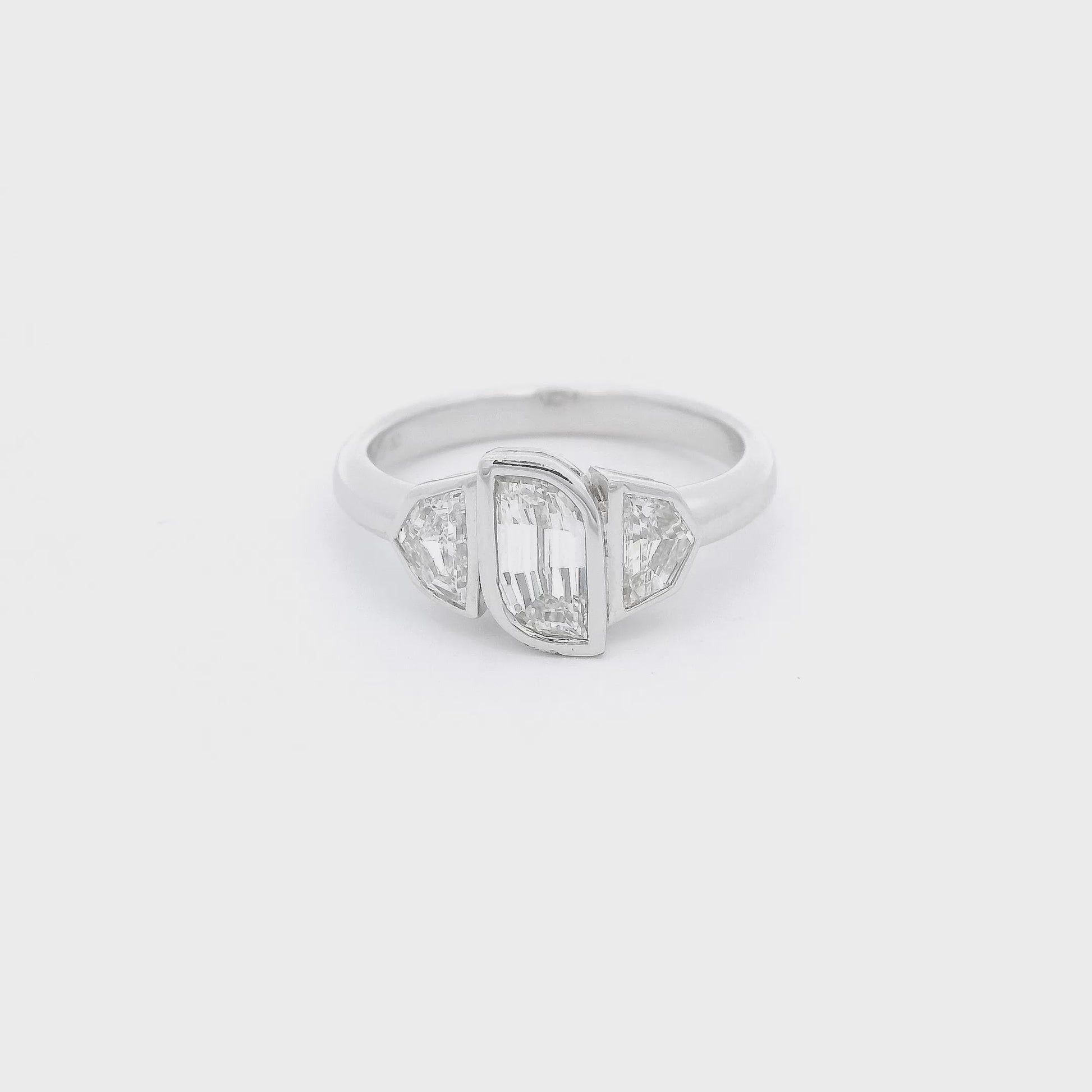 One flame cut diamond and two Cadillac cut diamonds bezel in in a white gold ring Forever Rox Fine Jewelry