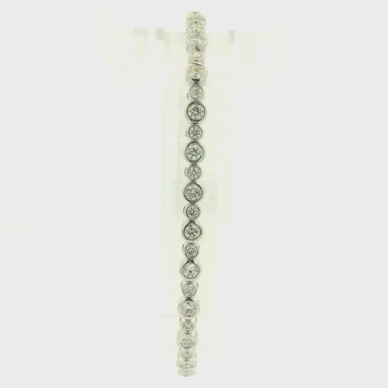 A Yellow & White Gold Flex Bangle with bezel set round cut natural Diamonds in  at Forever Rox Fine Jewelry, Lake Tahoes Best Jewelry Store
