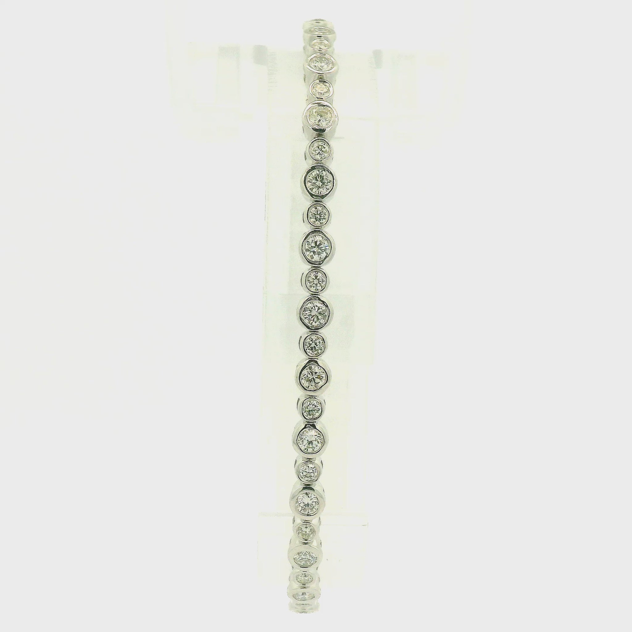 A Yellow & White Gold Flex Bangle with bezel set round cut natural Diamonds in  at Forever Rox Fine Jewelry, Lake Tahoes Best Jewelry Store
