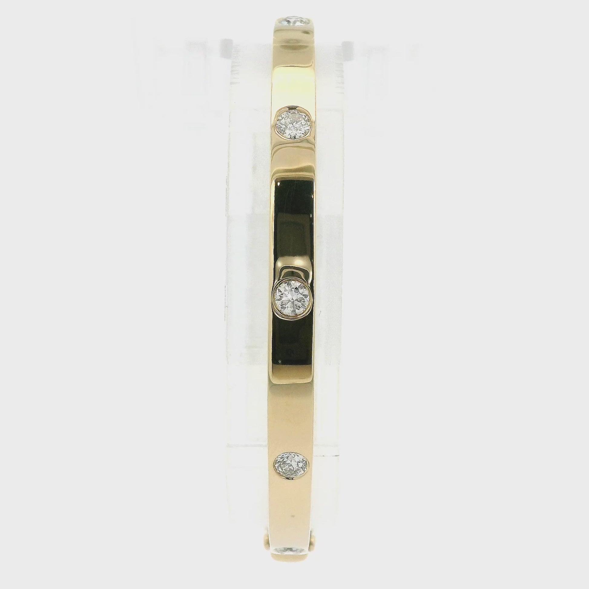 A Yellow Gold Solid Bangle with 5 flush set round cut diamonds at Forever Rox Fine Jewelry, Lake Tahoes Best Jewelry Store