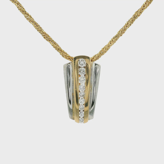 Two Tone Pendant with nine graduating size diamonds from small to large set in the center with an enhancer bail at Forever Rox Fine Jewelry