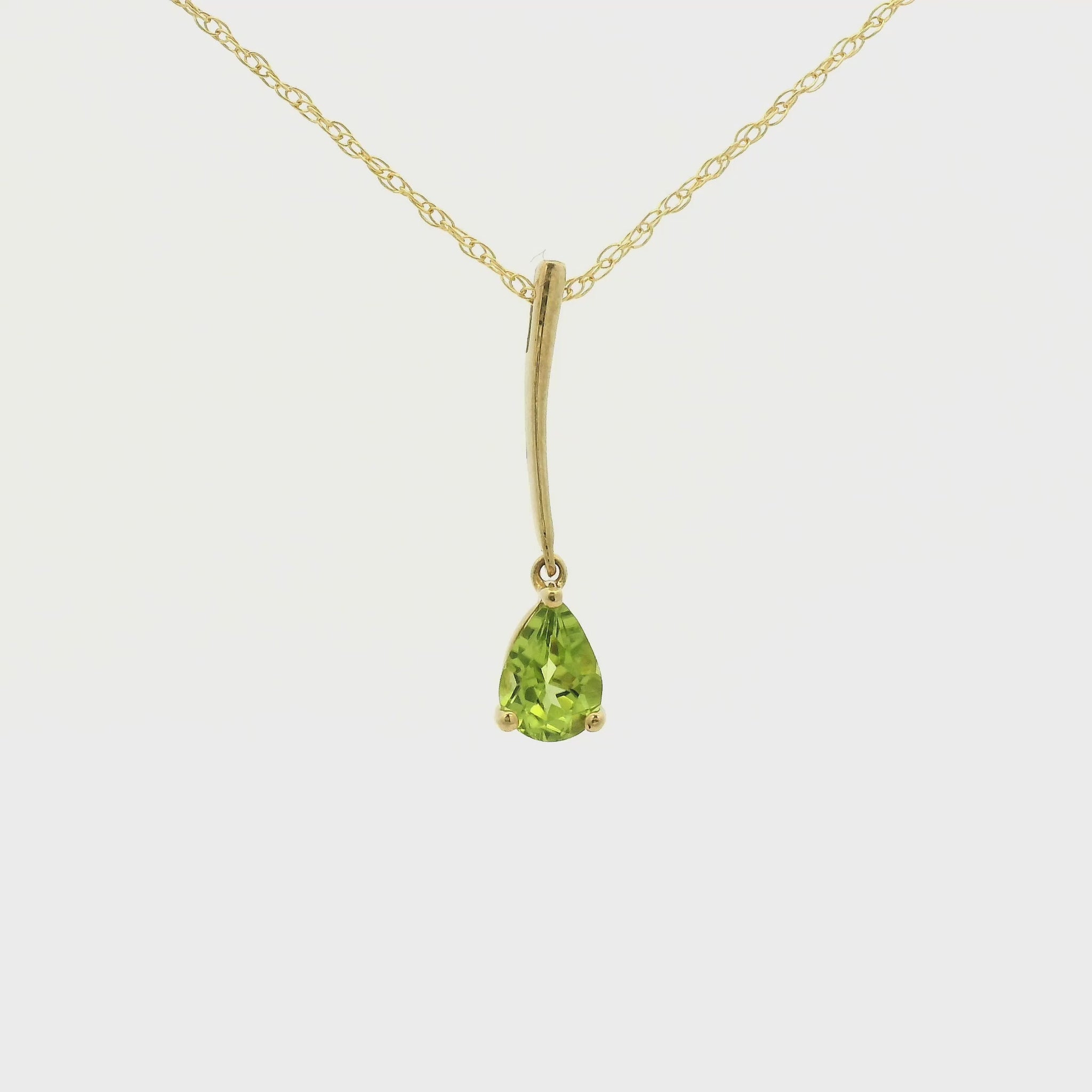 Yellow Gold Dangle Pendant with a prong set pear cut natural Peridot at Forever Rox Fine Jewelry, Lake Tahoes Best Jewelry Store
