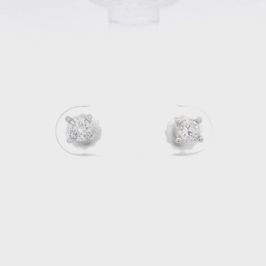 A pair of 4 prong diamond studs at Forever Rox Fine Jewelry 