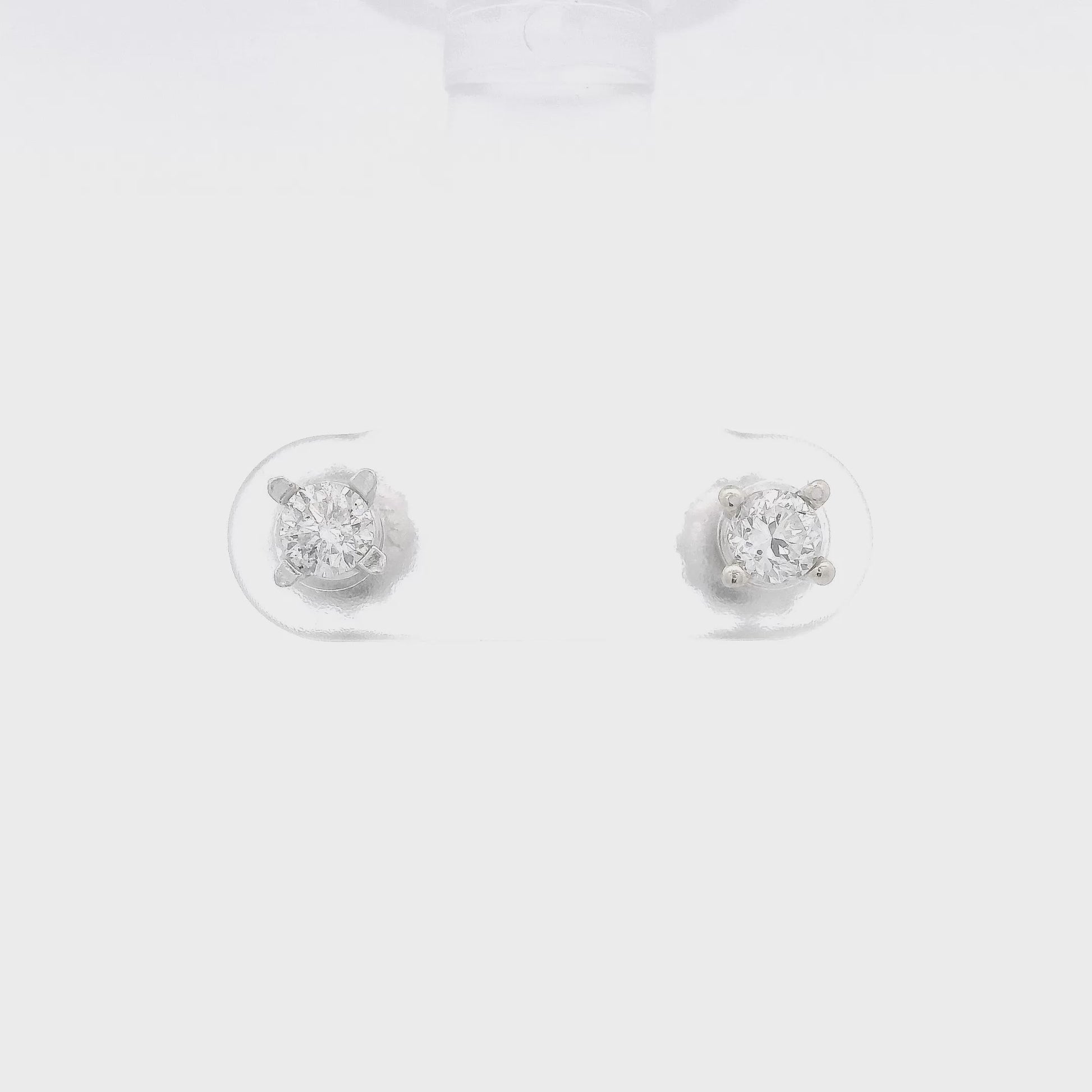 A pair of 4 prong diamond studs at Forever Rox Fine Jewelry 