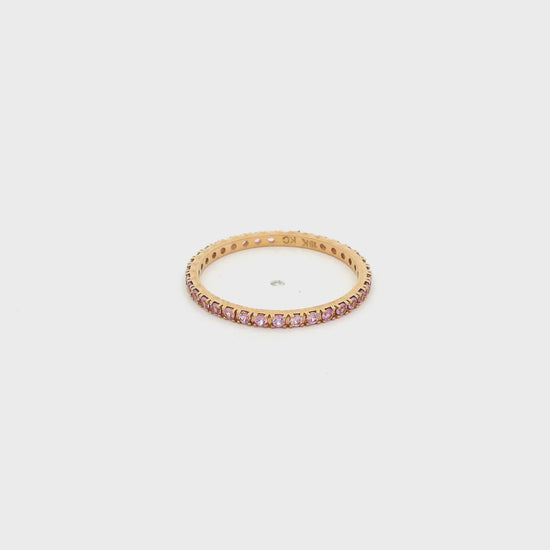 A Rose Gold Eternity Band with natural Pink Sapphires all the way around at Forever Rox Fine Jewelry, Lake Tahoes Best Jewelry Store