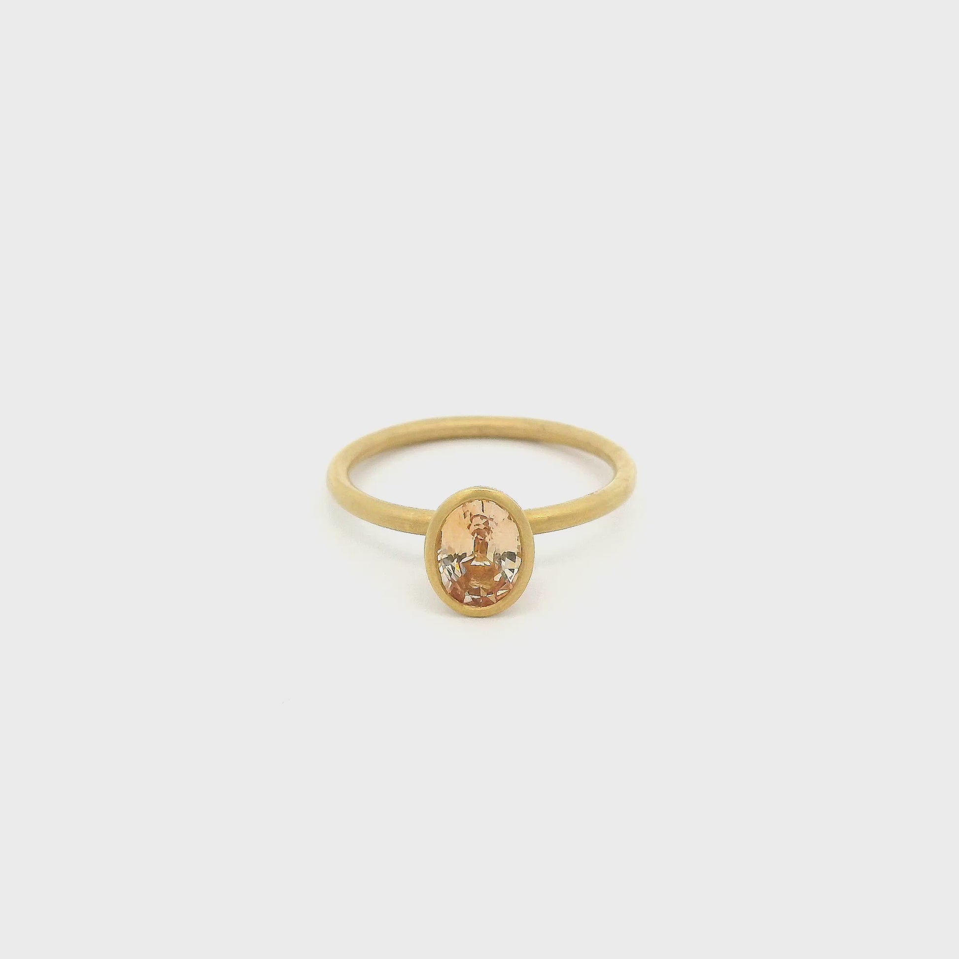 A Yellow Gold Ring with a bezel set fancy cut natural Sapphire in the center with a chain attached at Forever Rox Fine Jewelry, Lake Tahoes Best Jewelry Store