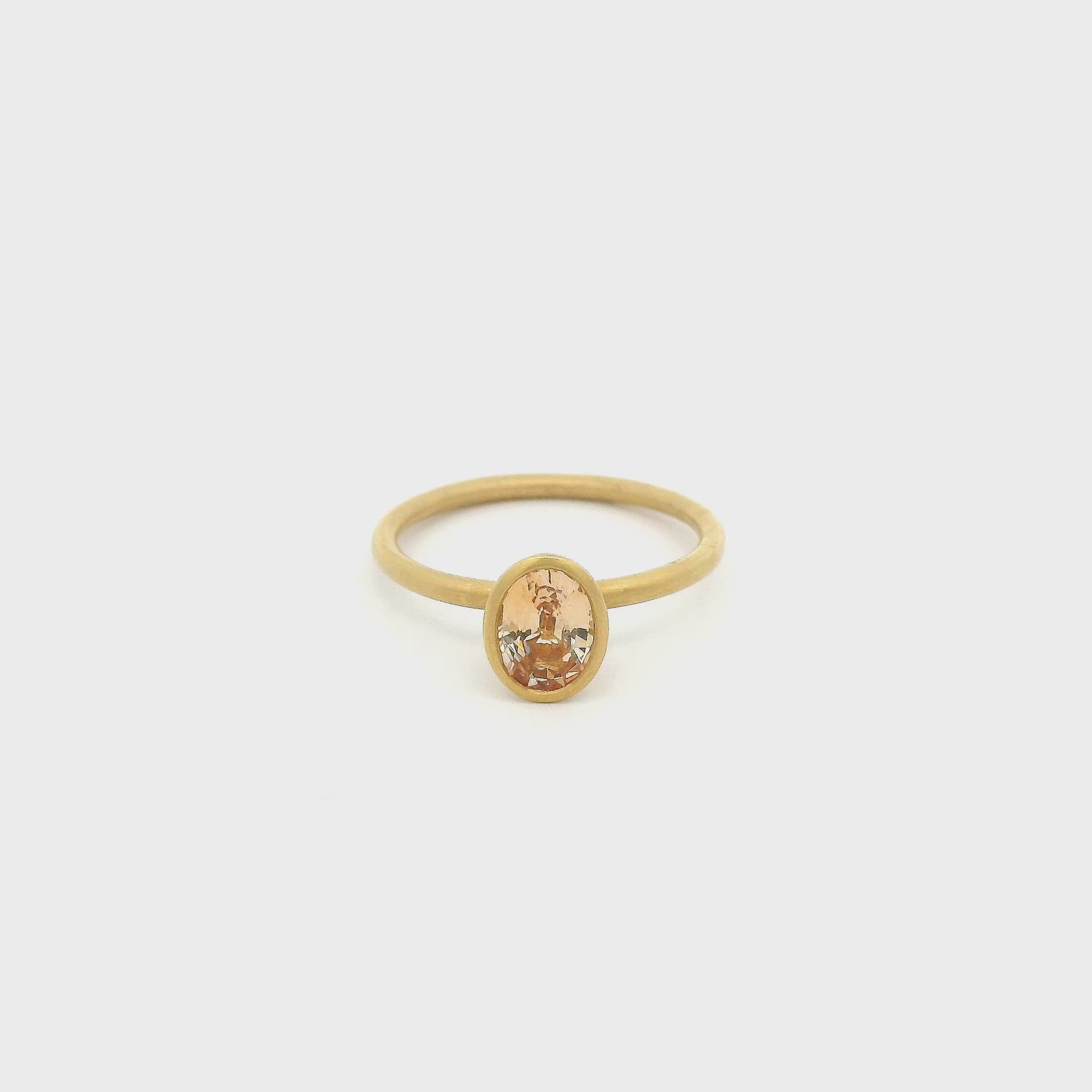 A Yellow Gold Ring with a bezel set fancy cut natural Sapphire in the center with a chain attached at Forever Rox Fine Jewelry, Lake Tahoes Best Jewelry Store