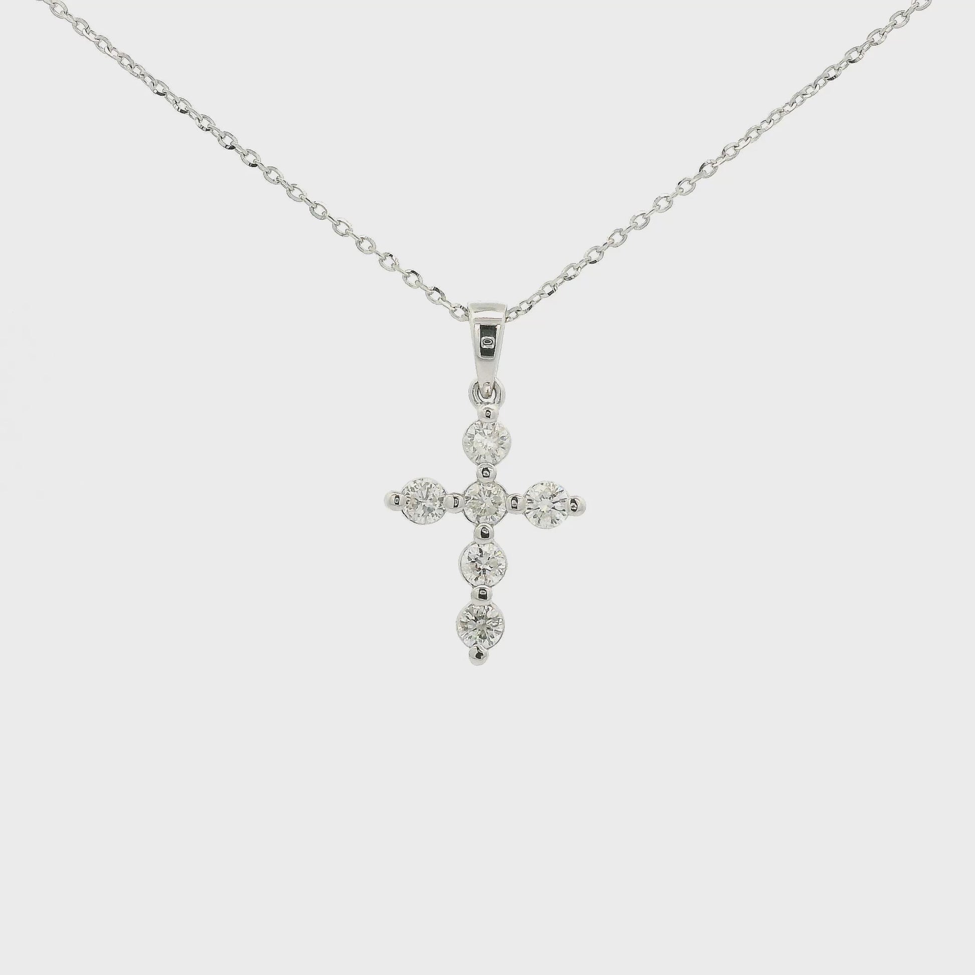 A White Gold Cross Pendant with 6 round cut Diamonds at Forever Rox Fine Jewelry, Lake Tahoes Best Jewelry Store