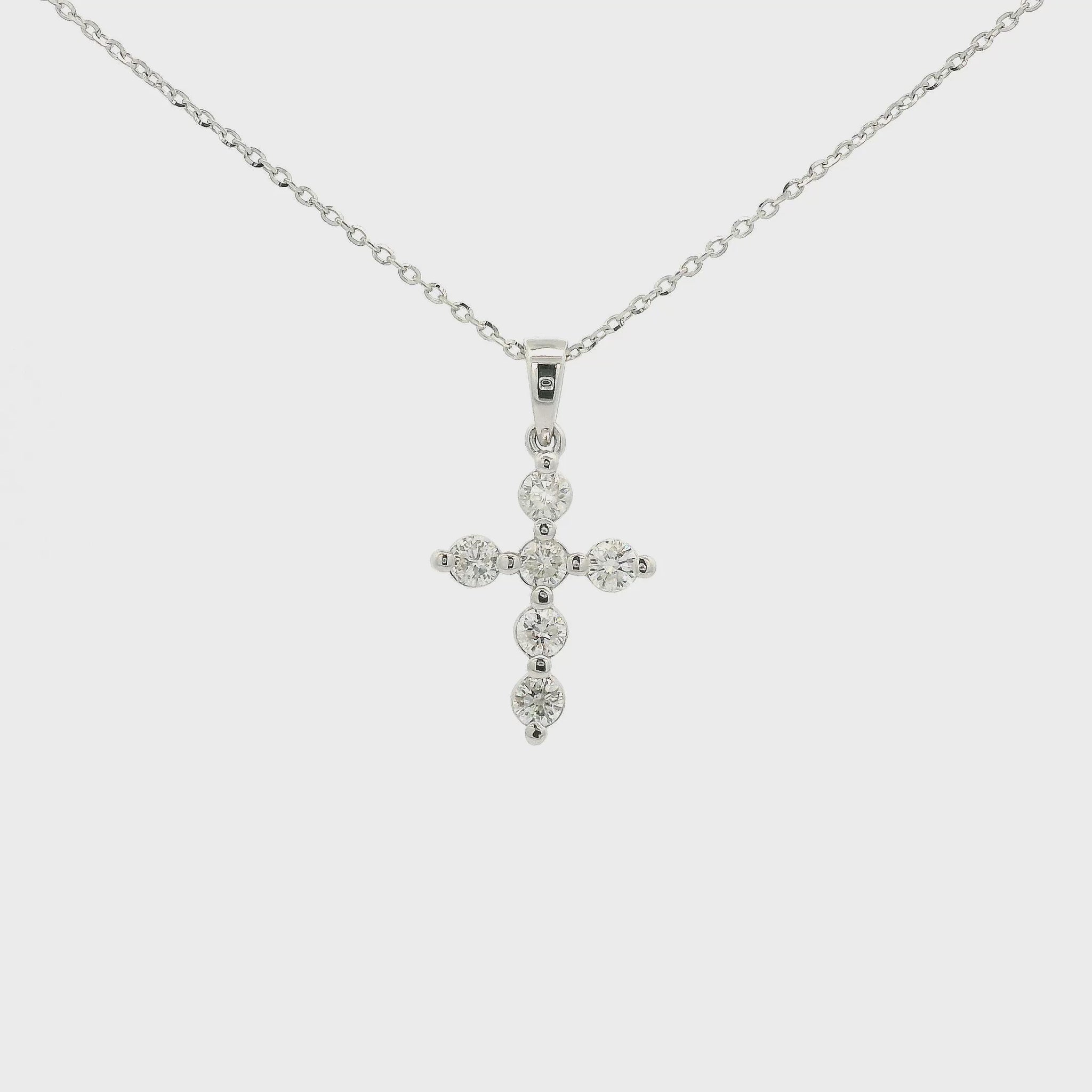 A White Gold Cross Pendant with 6 round cut Diamonds at Forever Rox Fine Jewelry, Lake Tahoes Best Jewelry Store
