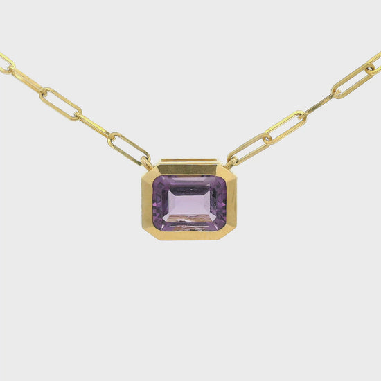 Gold Pendant with a Emerald cur Amethyst in the center attached to a paperclip chain at Forever Rox Fine Jewelry