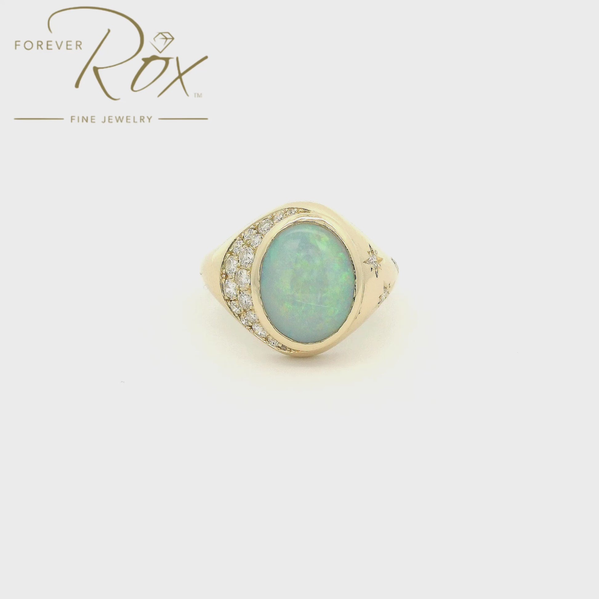 Custom 14k yellow gold oval opal ring with 0.24ctw diamond crescent moon and diamond star accents by Forever Rox Fine Jewelry, Lake Tahoes Best Jewelry Store