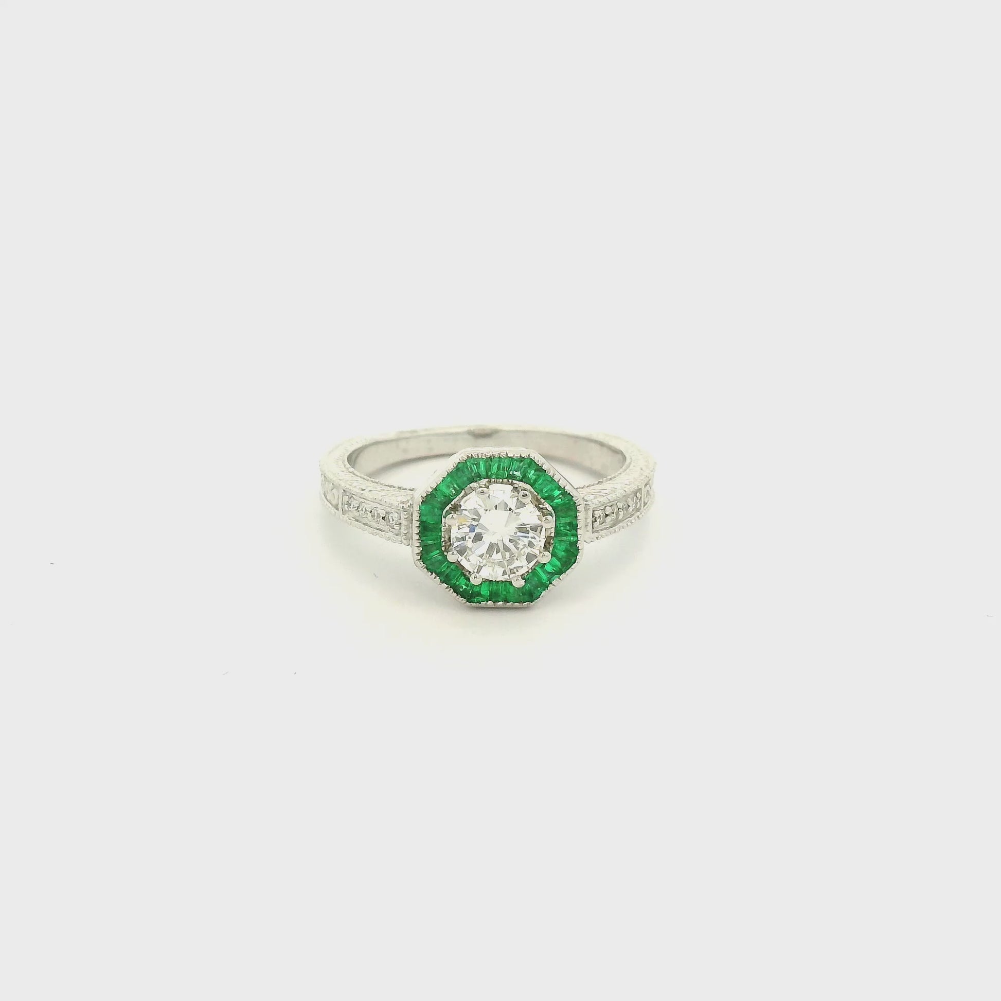 A White Gold Ring with a prong set old mine cut natural Diamond in the center with a halo of baguette cut emeralds at Forever Rox Fine Jewelry, Lake Tahoes Best Jewelry Store