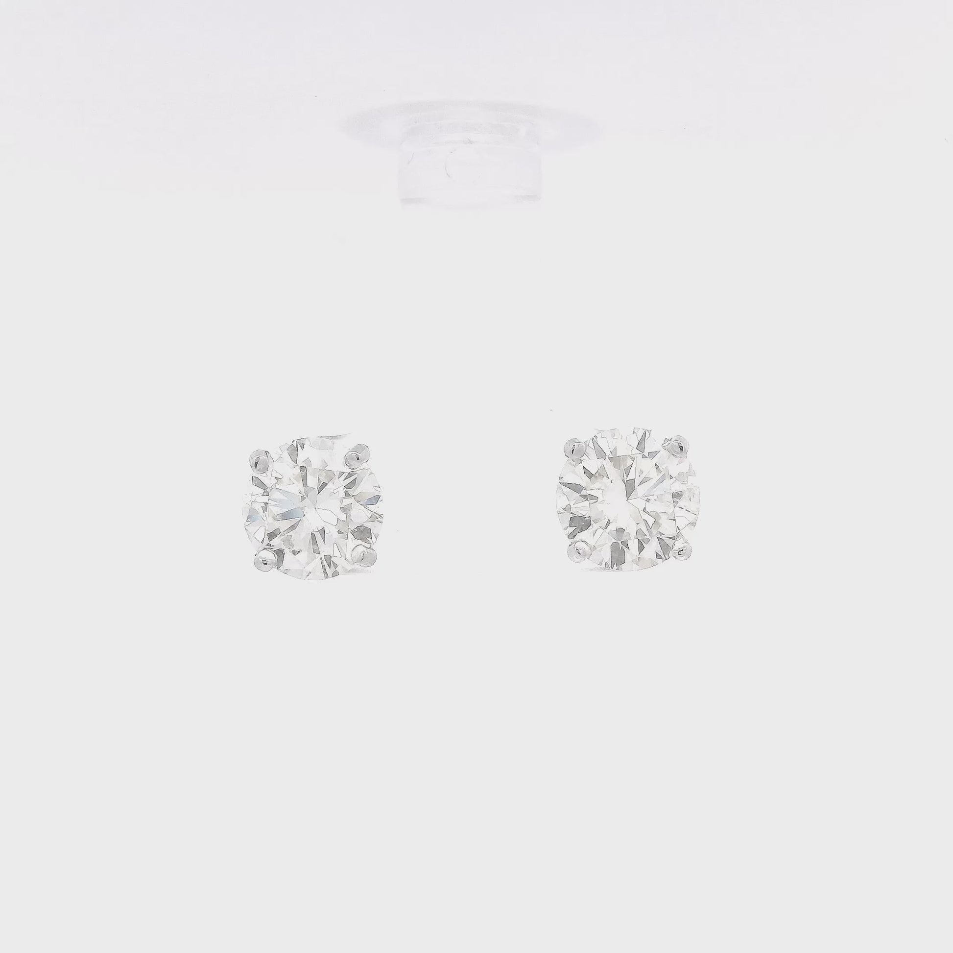 4 Prong 14k White Gold Studs with 3.48ctw of round cut diamonds set in the earrings at Forever Rox Fine Jewelry
