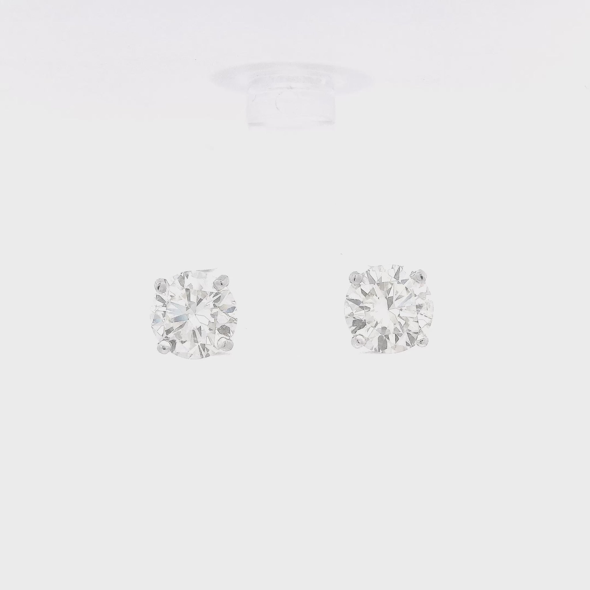 4 Prong 14k White Gold Studs with 3.48ctw of round cut diamonds set in the earrings at Forever Rox Fine Jewelry
