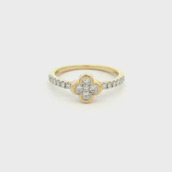 Yellow gold ring with diamonds and a clover shaped bezel at Forever Rox Fine Jewelry