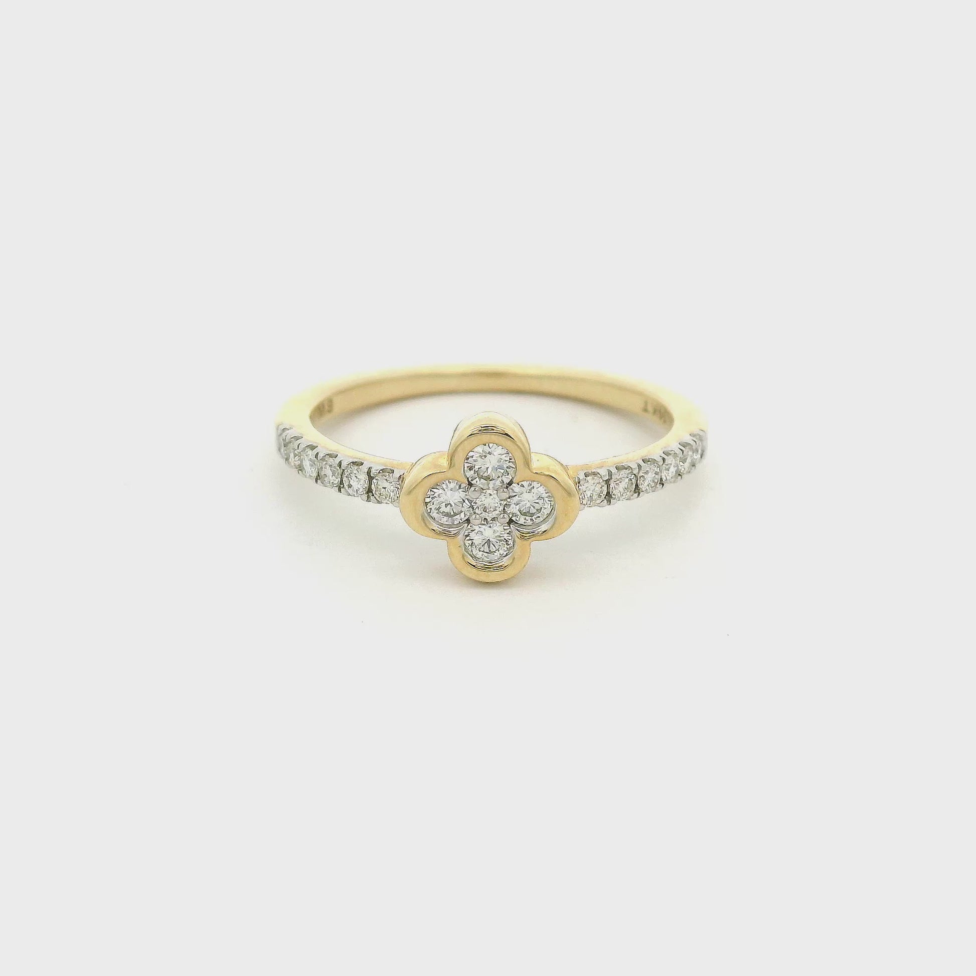 Yellow gold ring with diamonds and a clover shaped bezel at Forever Rox Fine Jewelry