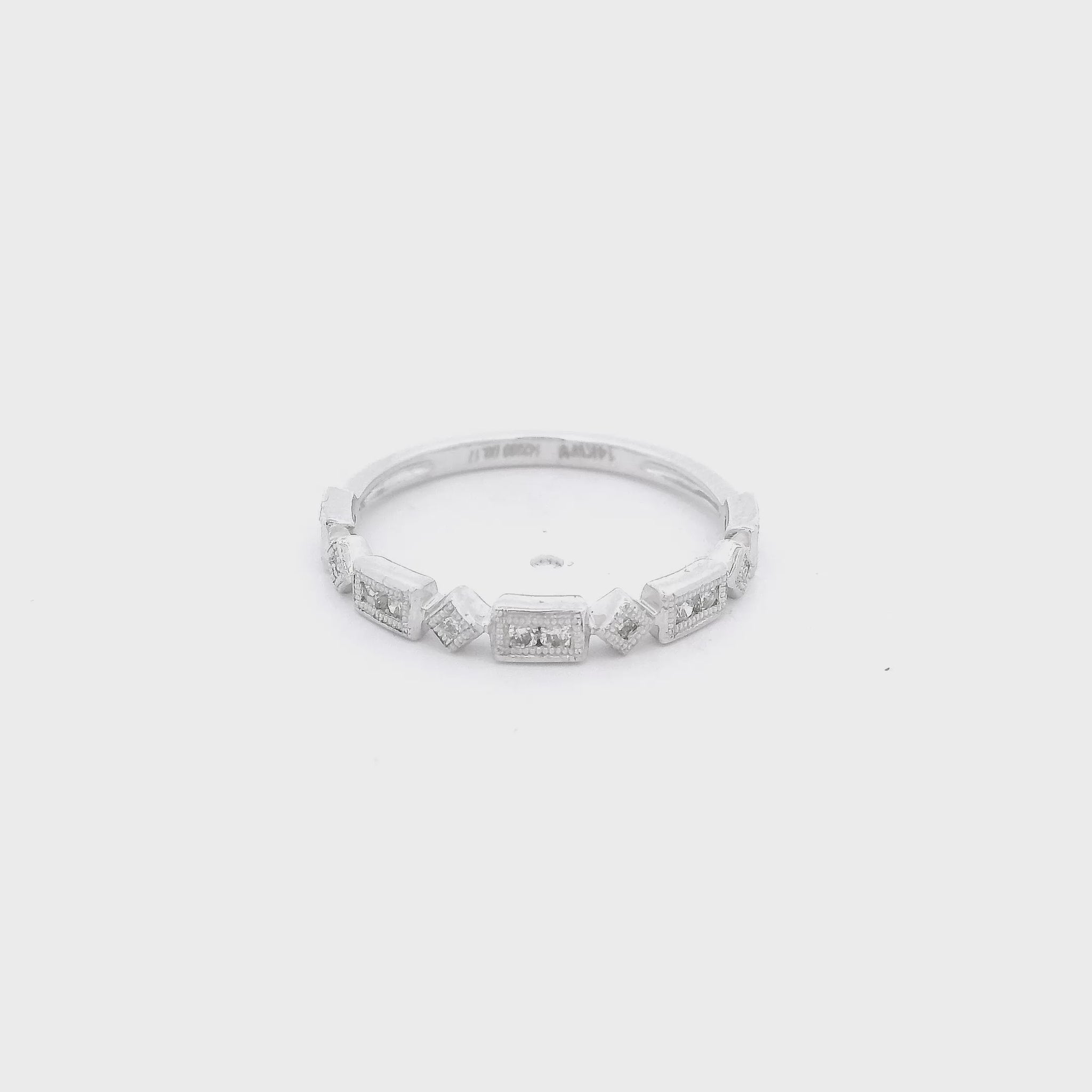 White Gold Band with Bbezel set round cut diamonds and milgrain design on the bezels at Forever Rox Fine Jewelry 
