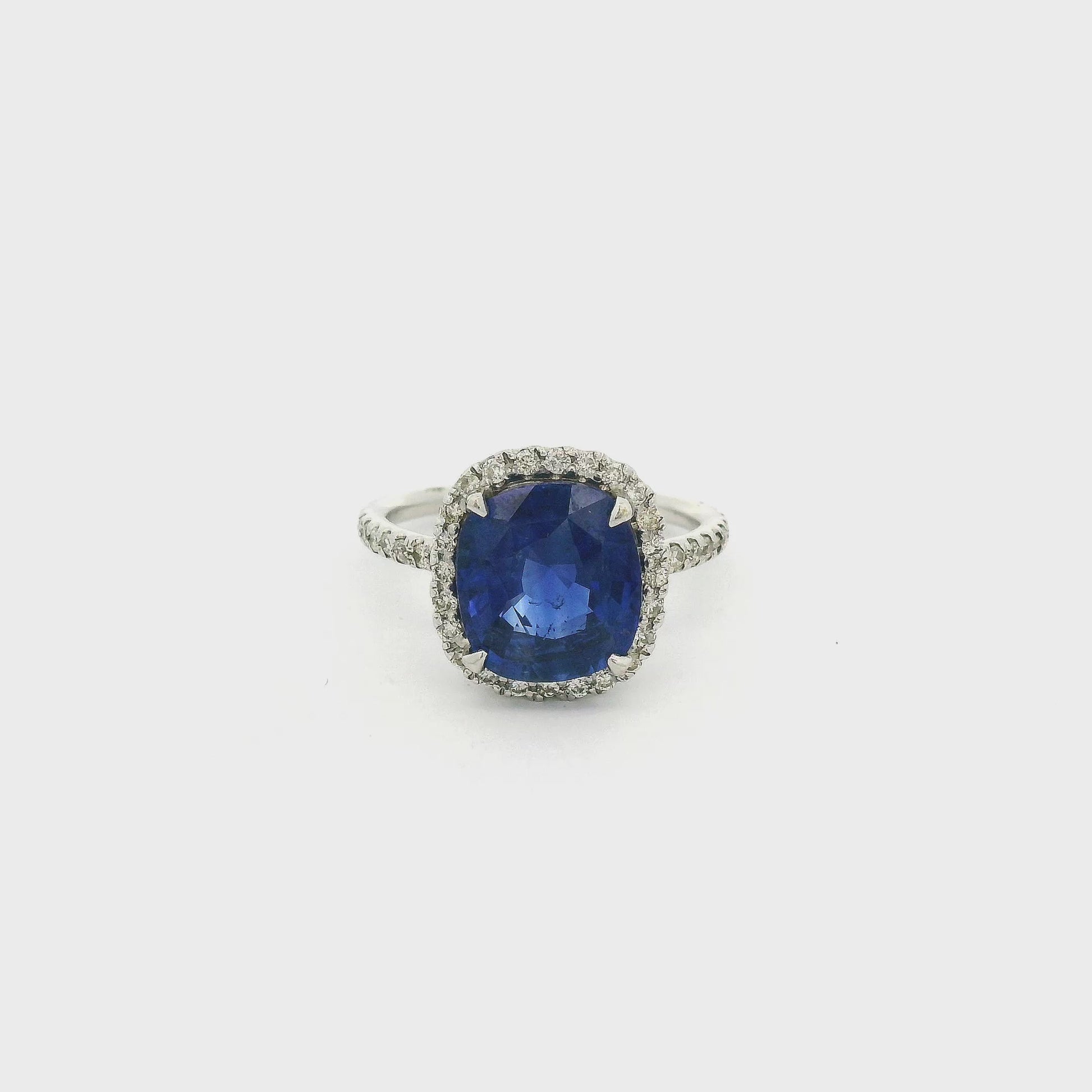 A White Gold Ring with a prong set square cushion cut natural Ceylon Sapphire in the center with a diamond halo and diamond eternity shank at Forever Rox Fine Jewelry, Lake Tahoes Best Jewelry Store
