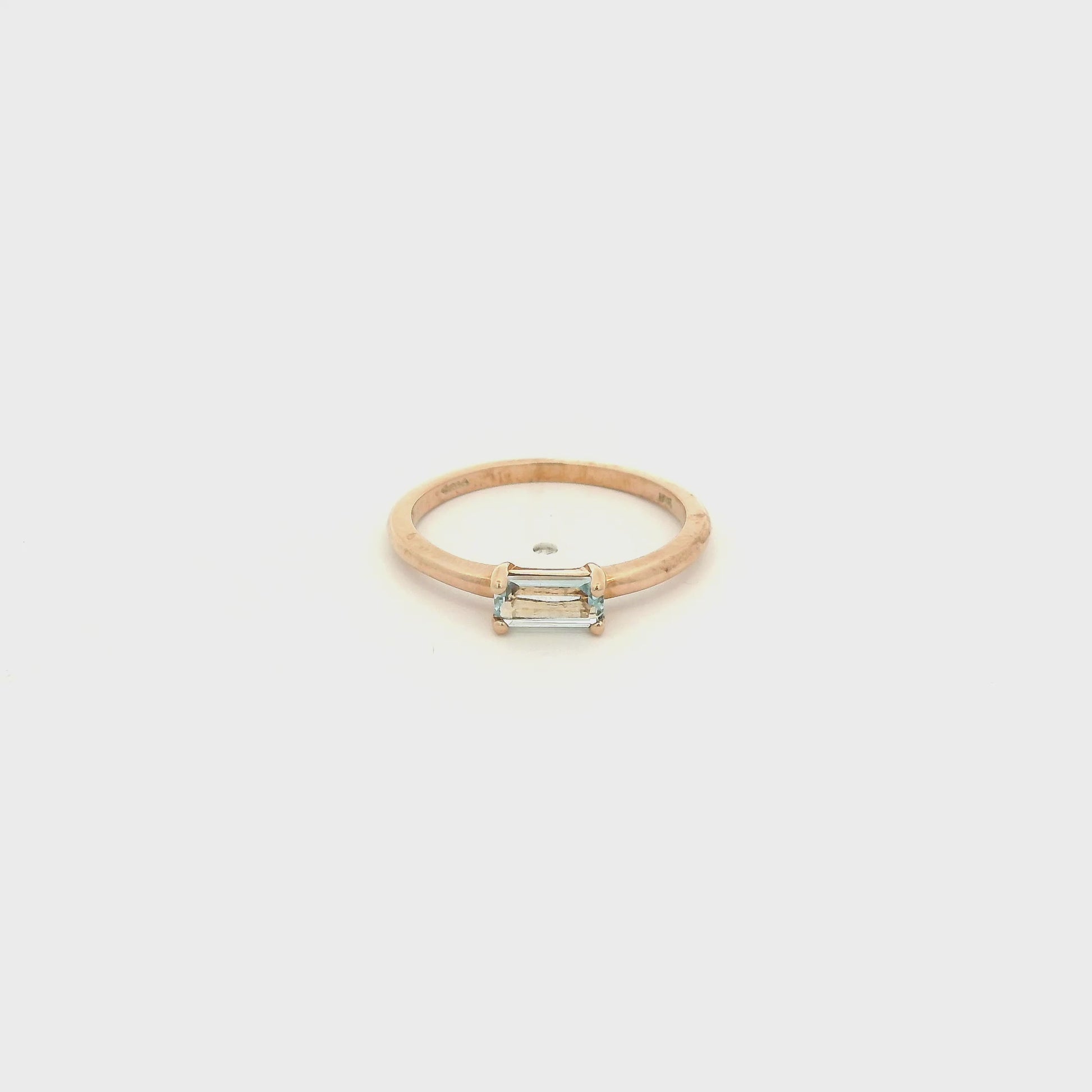A Yellow Gold Solitaire Ring with a prong set fancy baguette cut natural Blue Topaz in the center at Forever Rox Fine Jewelry, Lake Tahoes Best Jewelry Store