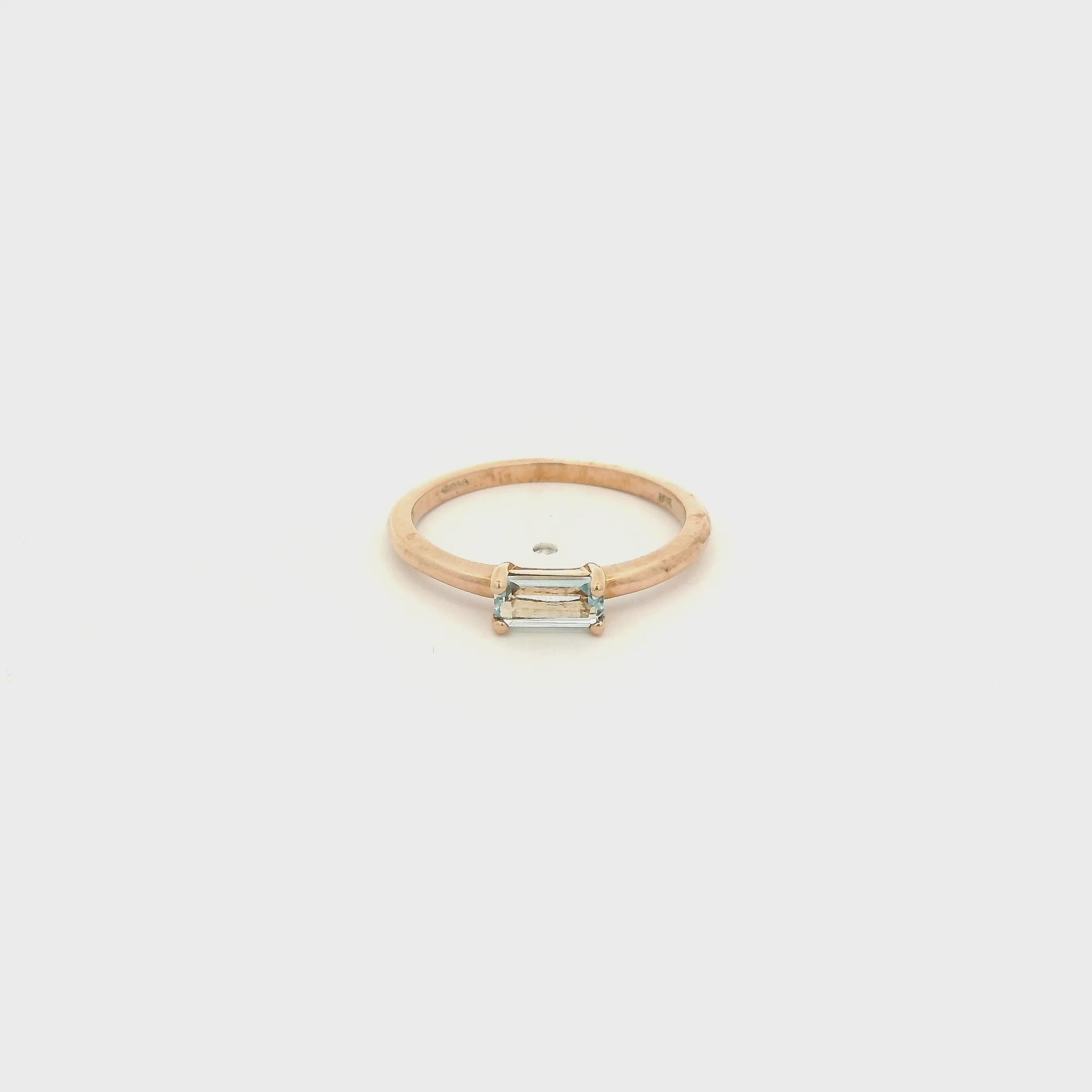 A Yellow Gold Solitaire Ring with a prong set fancy baguette cut natural Blue Topaz in the center at Forever Rox Fine Jewelry, Lake Tahoes Best Jewelry Store