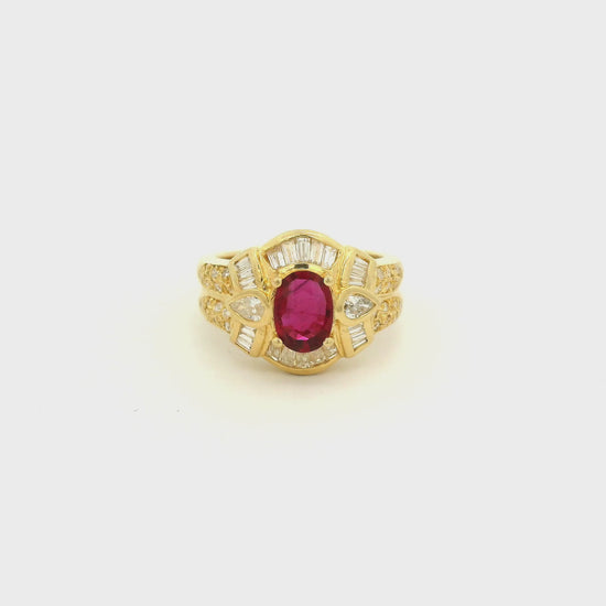 A Yellow Gold Ring with a prong set oval cut natural Ruby in the center with baguette, pear and round cut diamonds around it at Forever Rox Fine Jewelry, Lake Tahoes Best Jewelry Store