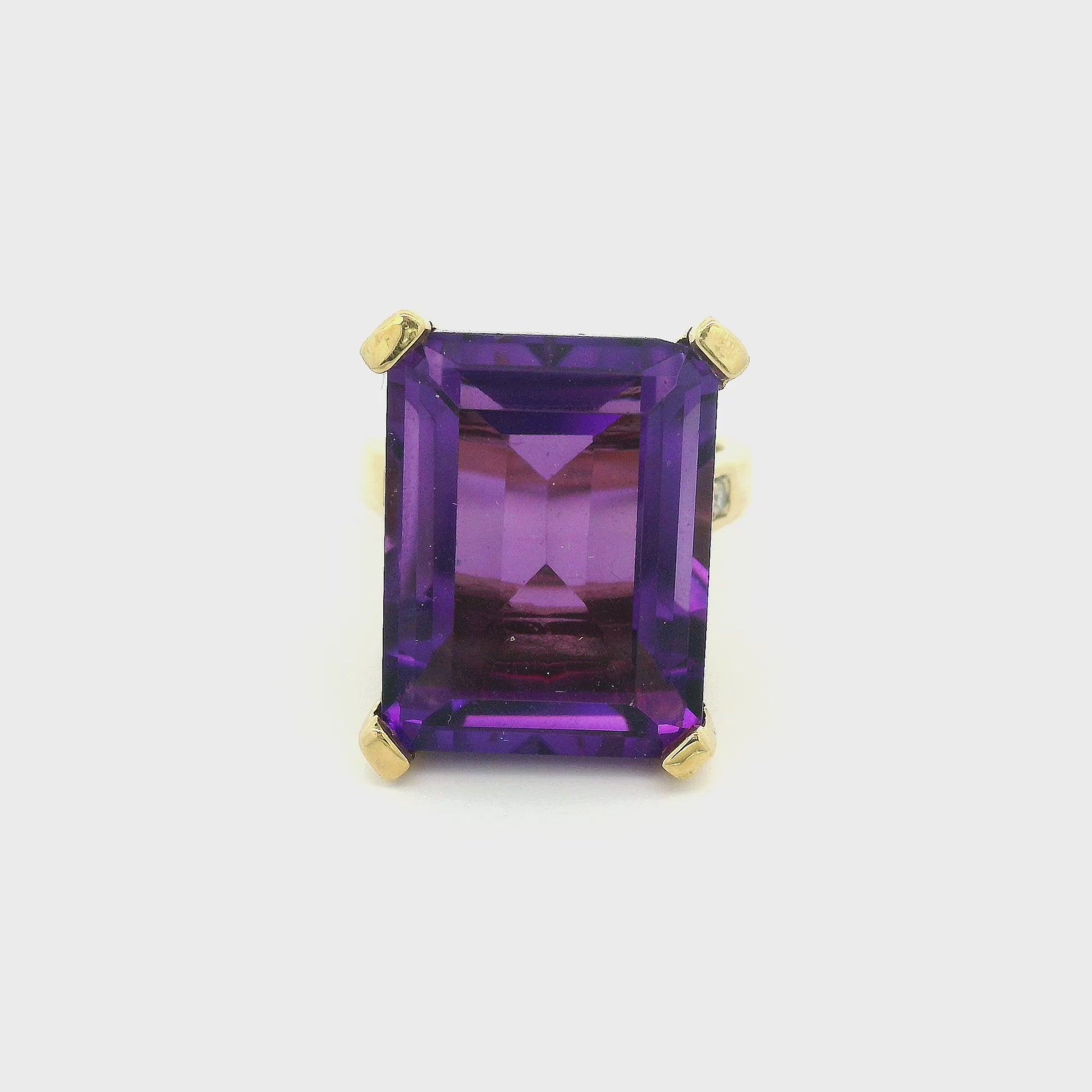 Emerald cut amethyst set in a yellow gold ring with diamonds at Forever Rox Fine Jewelry