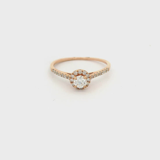 Rose Gold ring with diamond in the center and on the band at Forever Rox Fine Jewelry 