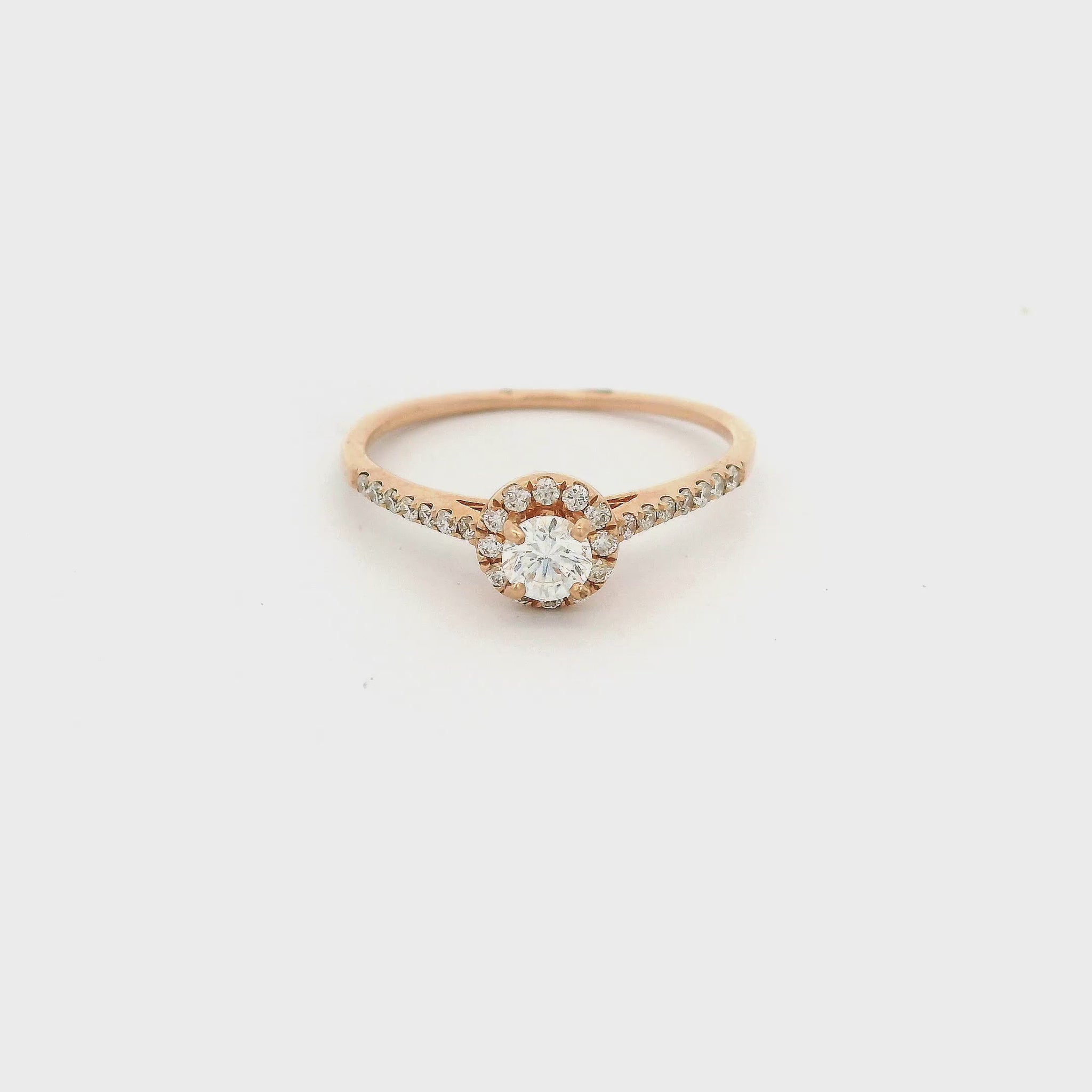 Rose Gold ring with diamond in the center and on the band at Forever Rox Fine Jewelry 