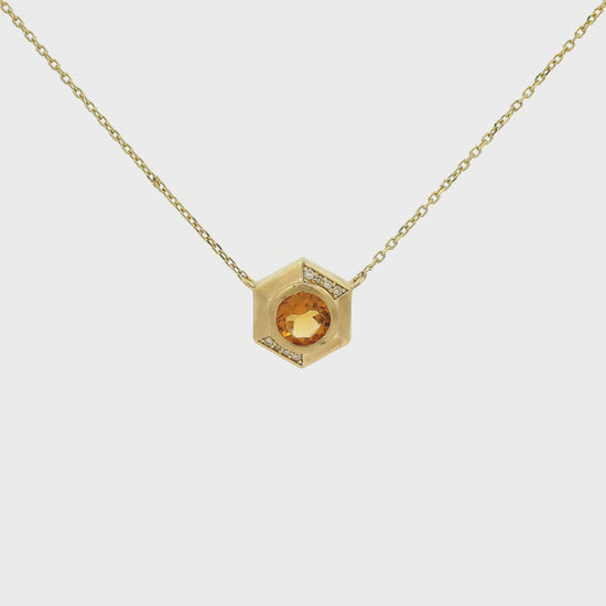 A Yellow Gold Octagon Pendant with a bezel set round cut natural Citrine in the center with diamonds and a chain attached at Forever Rox Fine Jewelry, Lake Tahoes Best Jewelry Store