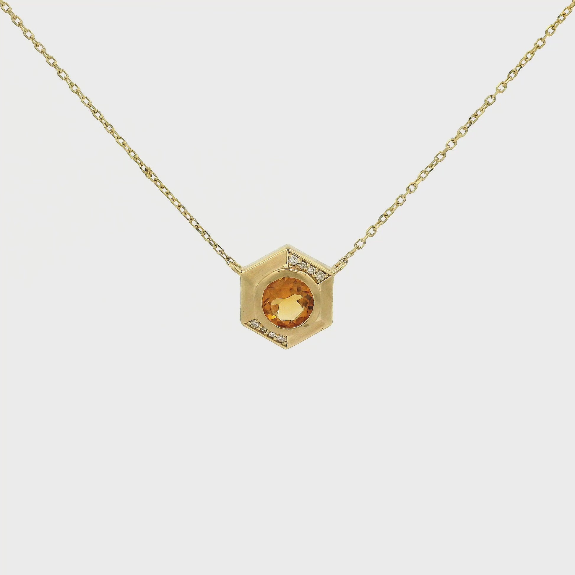 A Yellow Gold Octagon Pendant with a bezel set round cut natural Citrine in the center with diamonds and a chain attached at Forever Rox Fine Jewelry, Lake Tahoes Best Jewelry Store