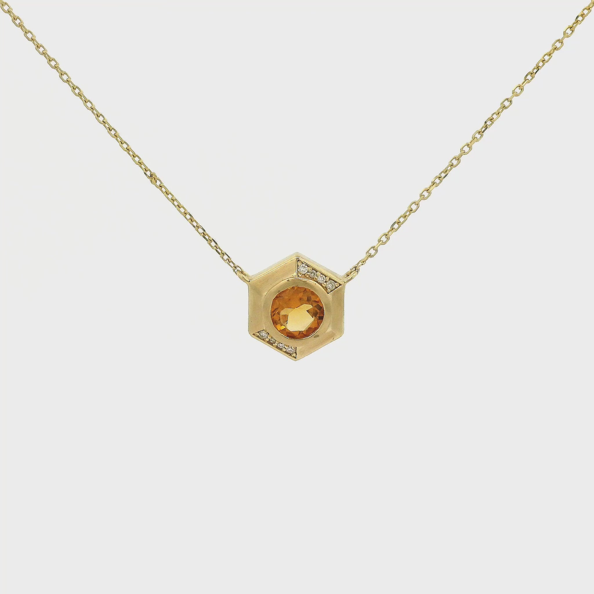A Yellow Gold Octagon Pendant with a bezel set round cut natural Citrine in the center with diamonds and a chain attached at Forever Rox Fine Jewelry, Lake Tahoes Best Jewelry Store