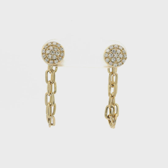 A Pair of Yellow Gold Stud Earrings with pavé set natural Diamonds in the center with a chain dangling from them at Forever Rox Fine Jewelry, Lake Tahoes Best Jewelry Store