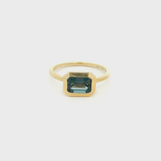 Gold ring with Emerald cut London blue topaz 