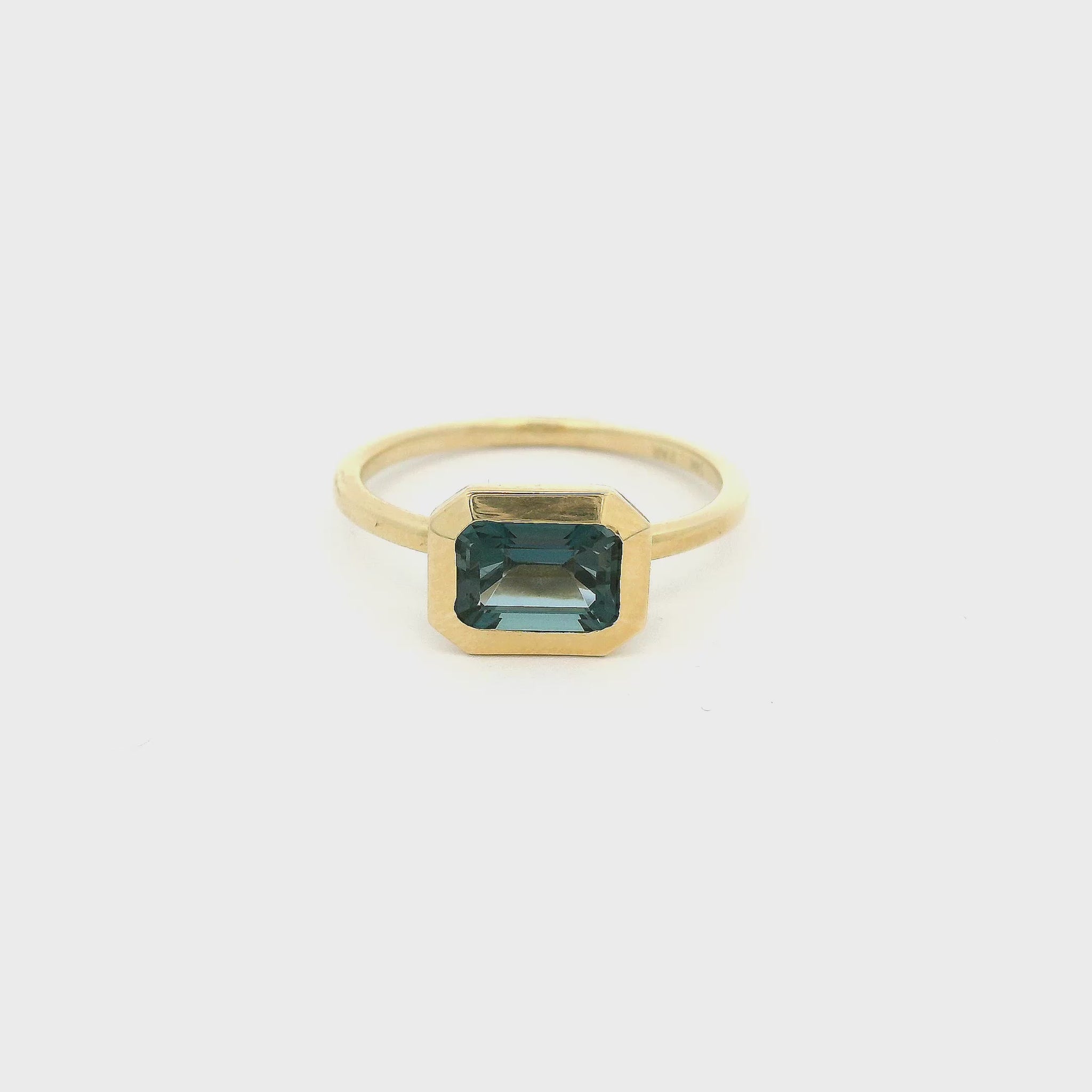 Gold ring with Emerald cut London blue topaz 