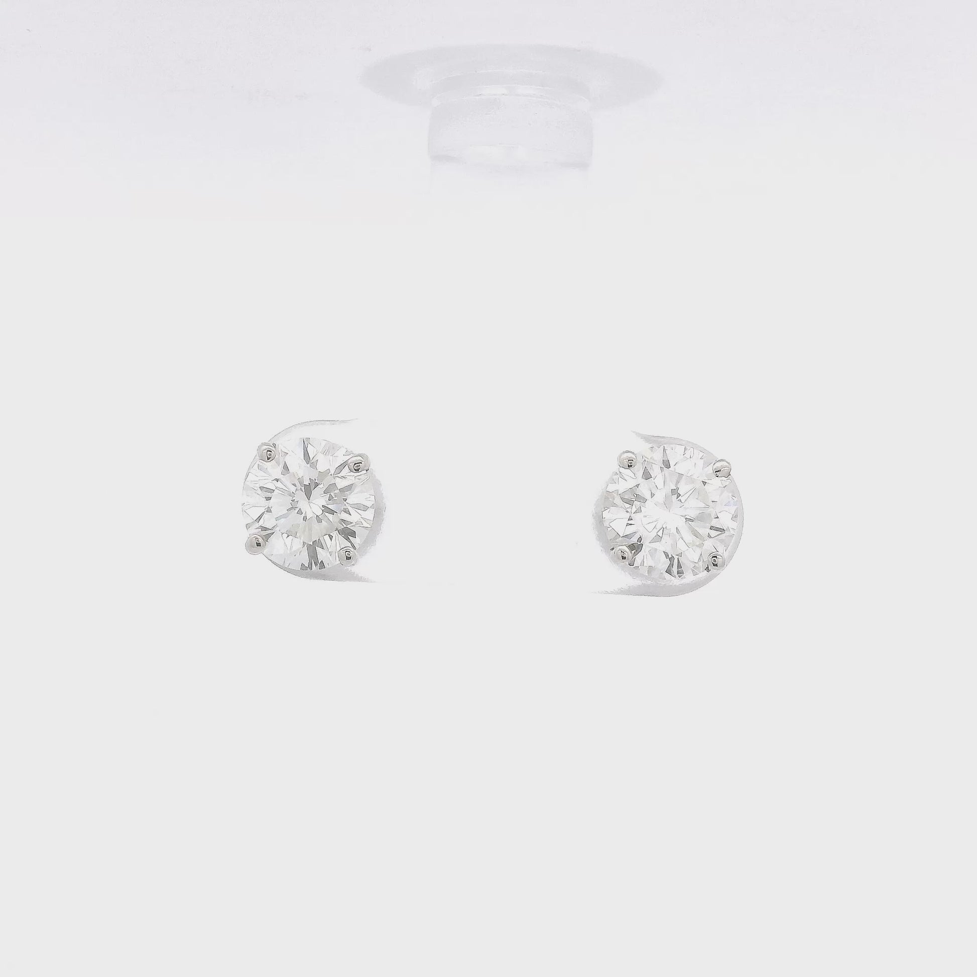 4 Prong White Gold Studs with 2.04ctw of orund cut diamonds set in the earrings at Forever Rox Fine Jewelry
