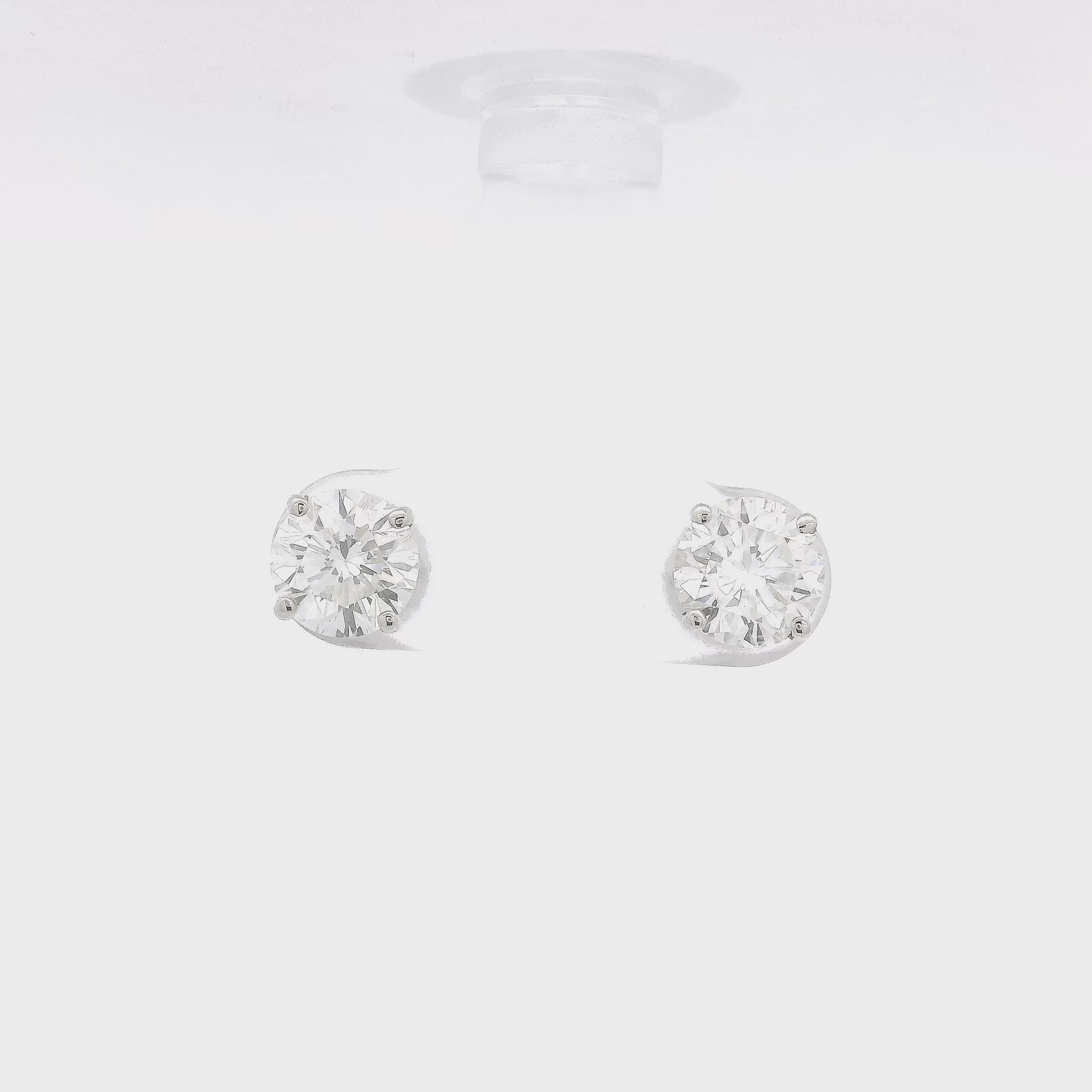 4 Prong White Gold Studs with 2.04ctw of orund cut diamonds set in the earrings at Forever Rox Fine Jewelry