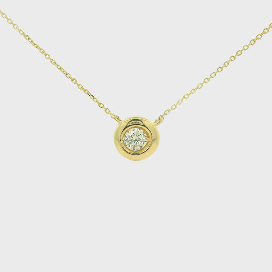 A Yellow Gold Pendant with a bezel set round cut natural Diamond in the center with a chain attached at Forever Rox Fine Jewelry, Lake Tahoes Best Jewelry Store
