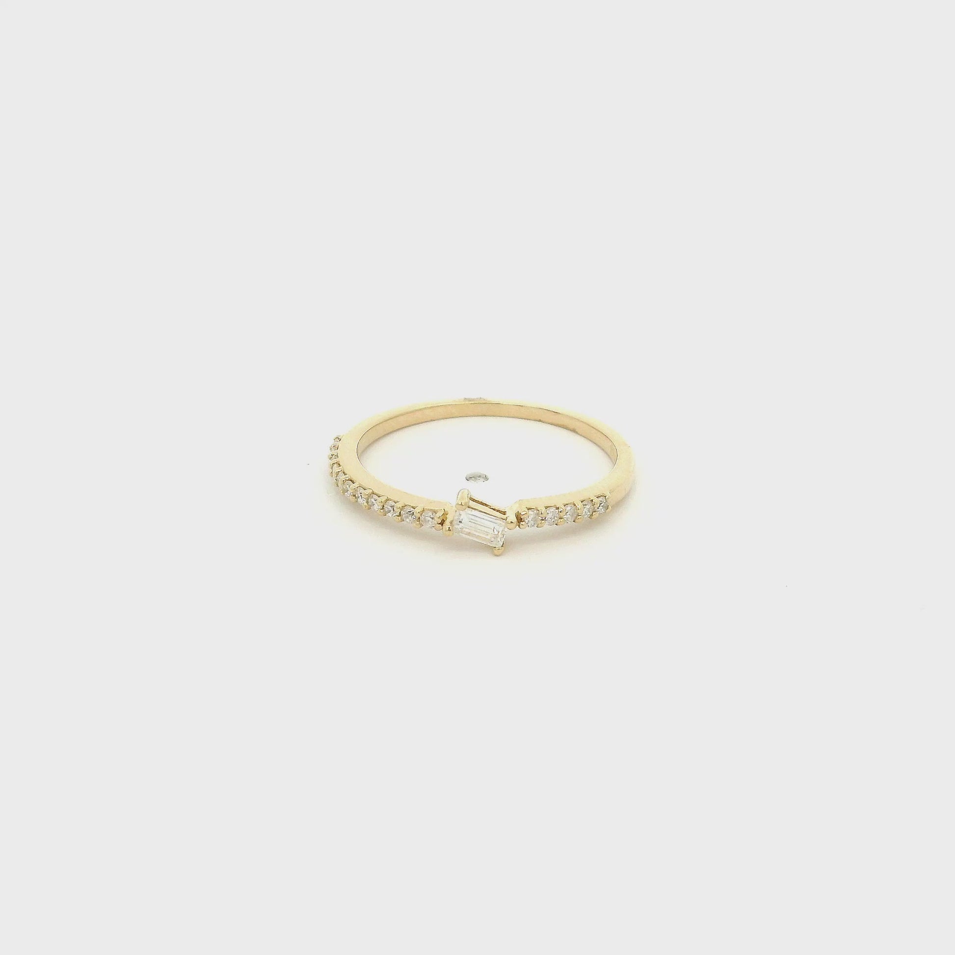 A Yellow Gold Ring with a offset prong set baguette cut natural Diamond in the center with diamonds down the shank at Forever Rox Fine Jewelry, Lake Tahoes Best Jewelry Store
