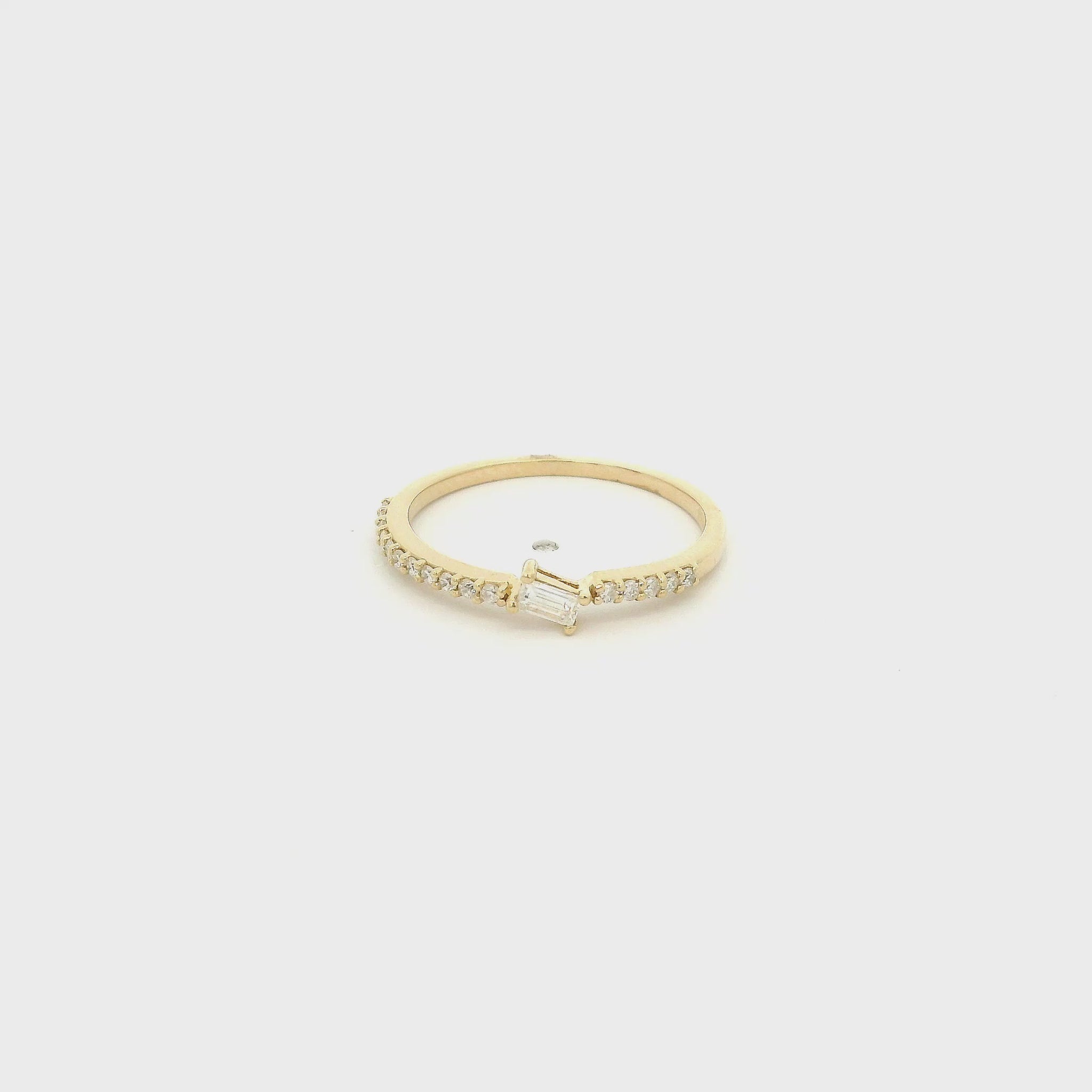 A Yellow Gold Ring with a offset prong set baguette cut natural Diamond in the center with diamonds down the shank at Forever Rox Fine Jewelry, Lake Tahoes Best Jewelry Store
