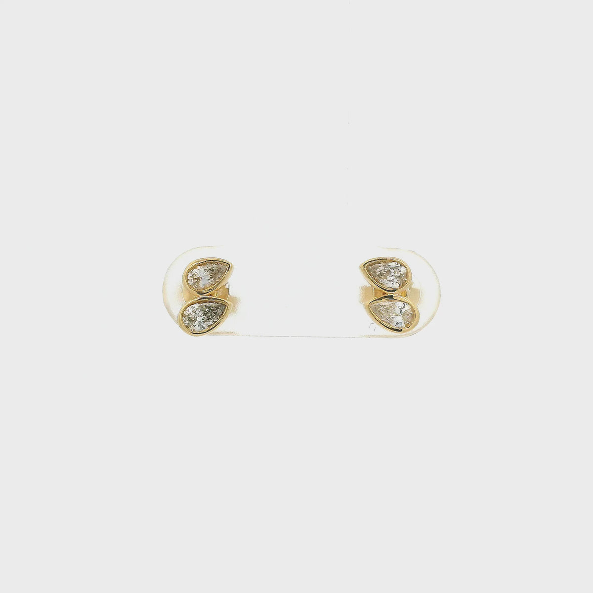 A Pair of Yellow Gold Stud Earrings with two bezel set pear cut natural Diamonds in each earring at Forever Rox Fine Jewelry, Lake Tahoes Best Jewelry Store
