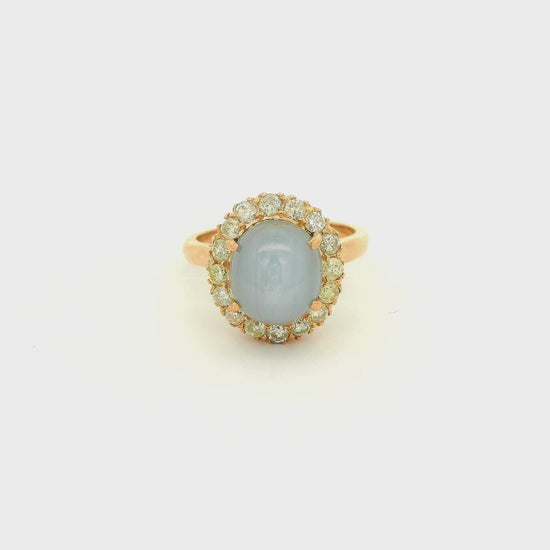 A Rose Gold Ring with a prong set cabochon cut natural Star Sapphire in the center with a diamond halo at Forever Rox Fine Jewelry, Lake Tahoes Best Jewelry Store